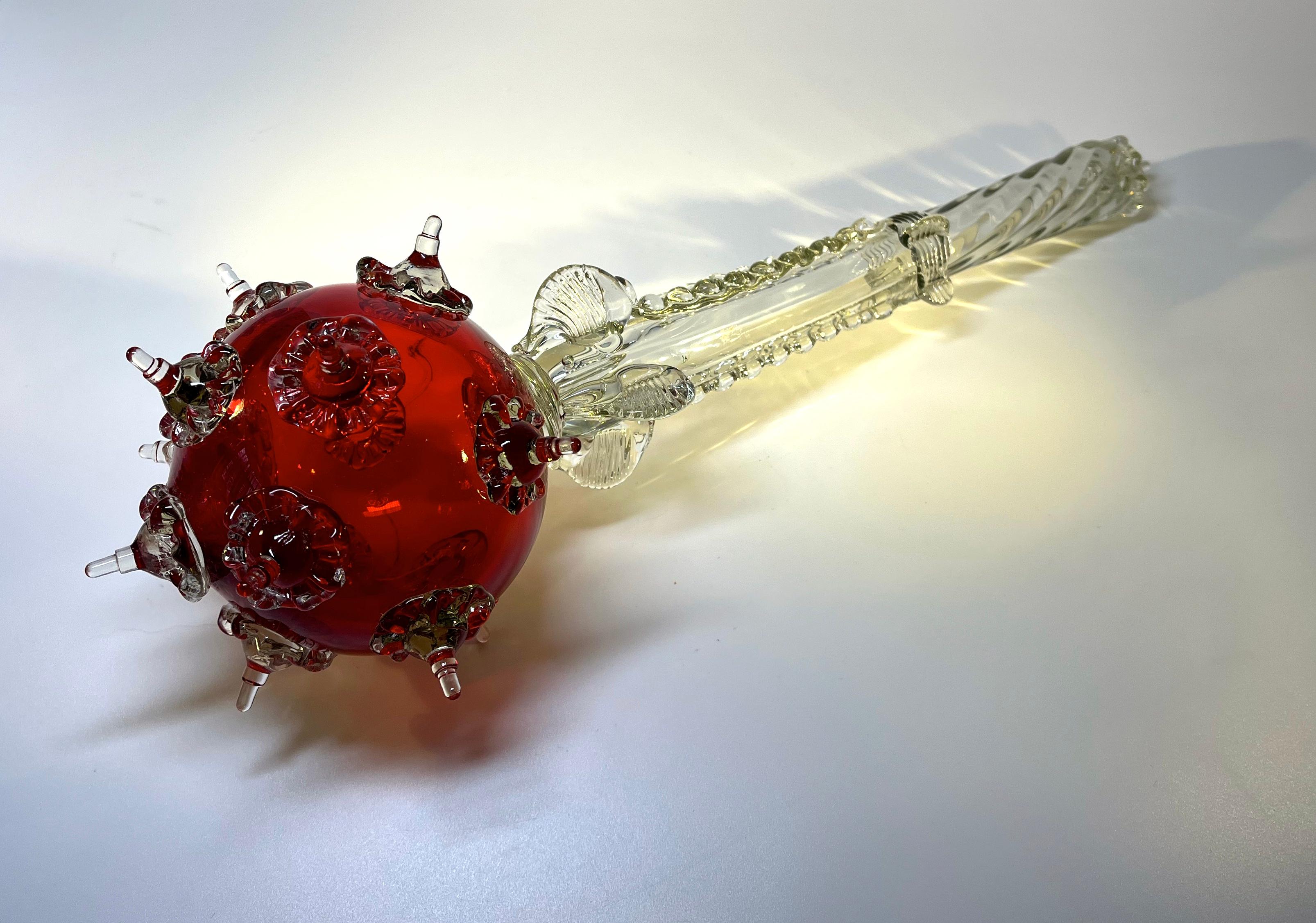 Elaborate and beautifully created ruby red glass sceptre
An striking piece of Murano for the collector
Circa 1970's 
Measures: Length 16 inch, Diameter 5 inch
In good condition. Two issues, one point missing from sceptre head and a small wing