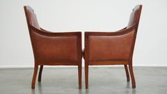 Majestic set of 2 cognac-colored cow leather Art Deco design armchairs