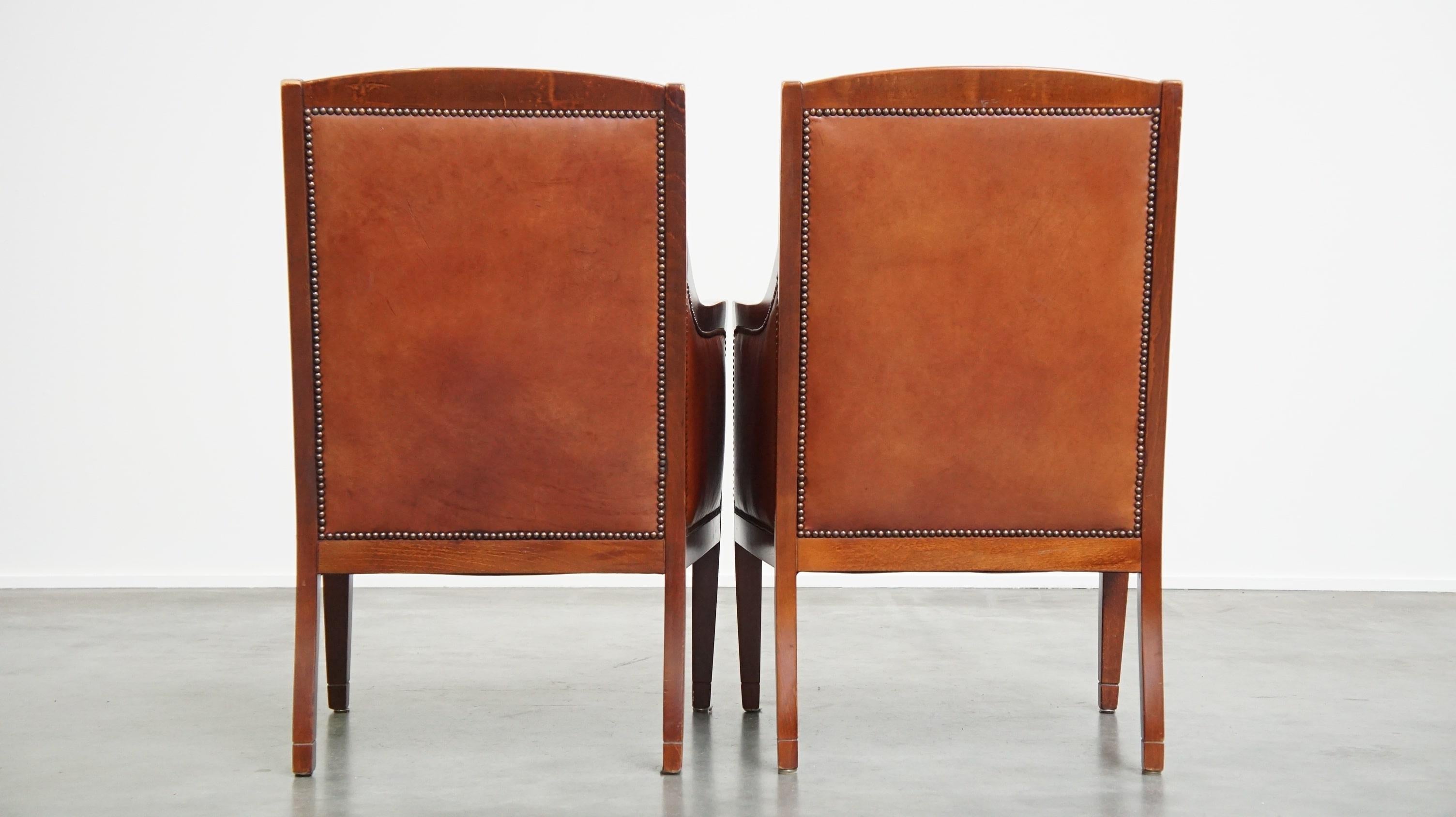 Art Déco Majestic, set di 4 poltrone in pelle di mucca color cognac dal design Art Deco in vendita