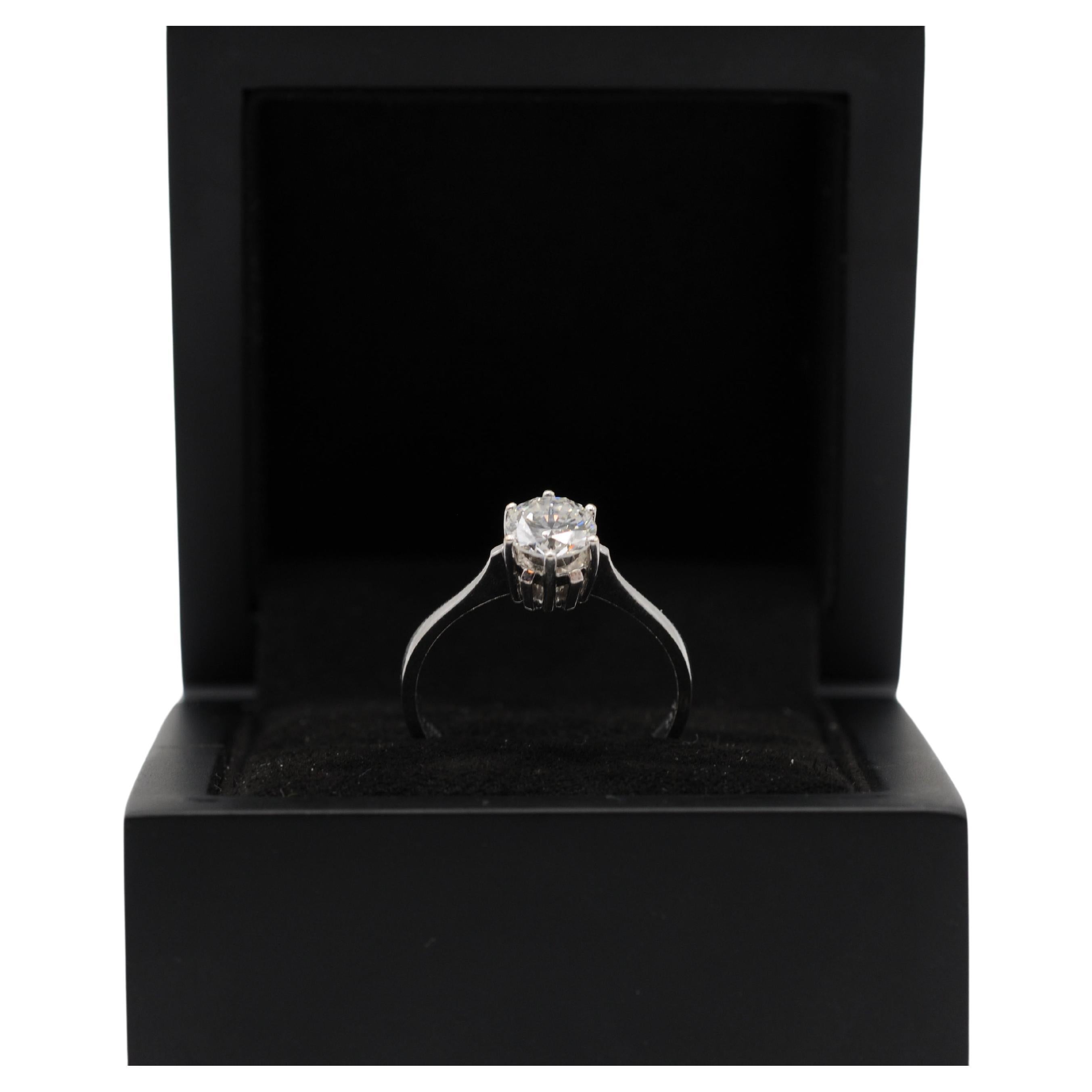 
Embark on a journey of elegance with this exquisite diamond ring featuring a 6-prong crab setting, crafted from lustrous 14k white gold. This captivating ring showcases a diamond with the following exceptional characteristics:

Gemstone