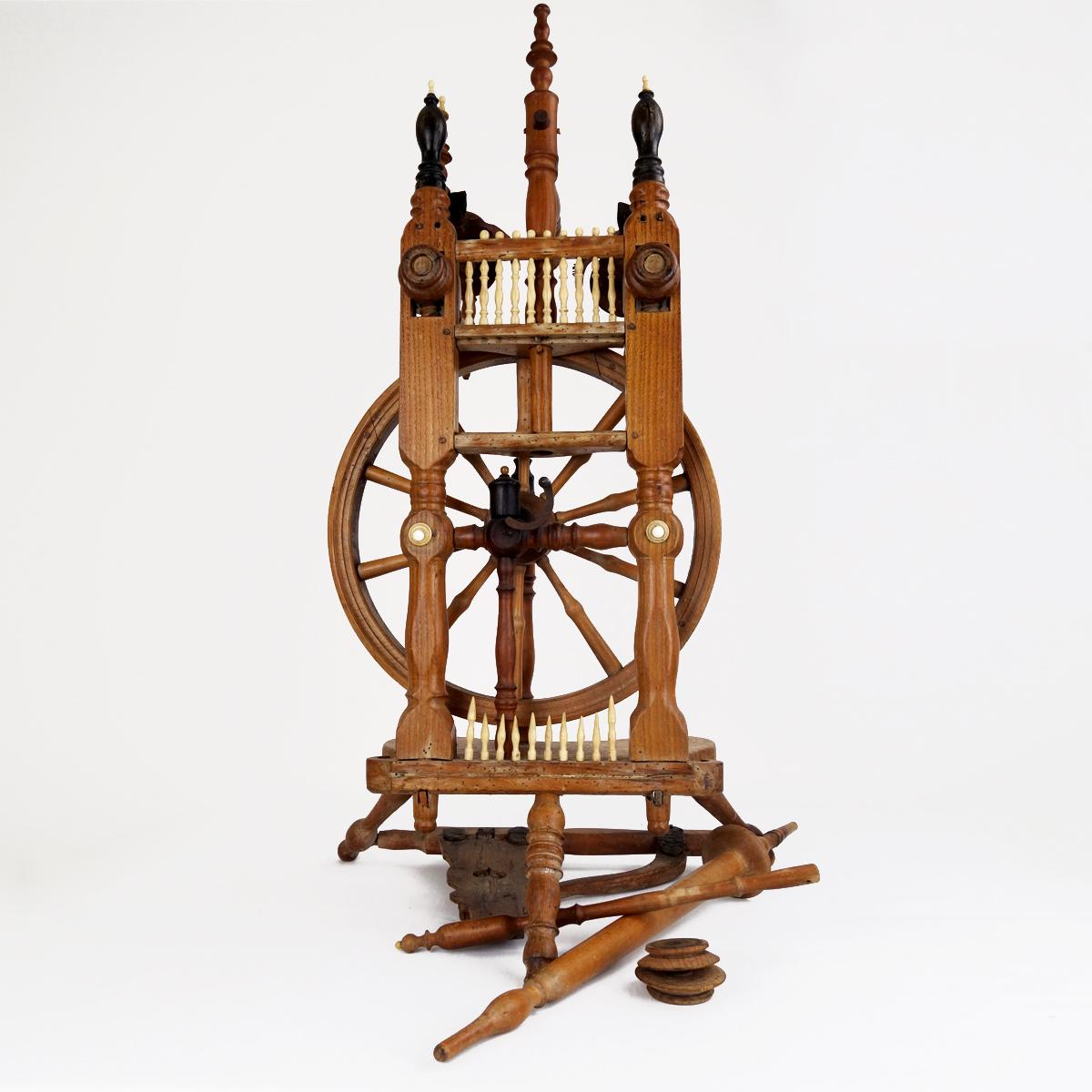 Not only Sleeping Beauty's hair has the color of ebony wood, so do a number of details of this antique spinning wheel. The well shaped lances and buttons made of bone are in a beautiful contrast with the aged wood of the frame.
This centerpiece has