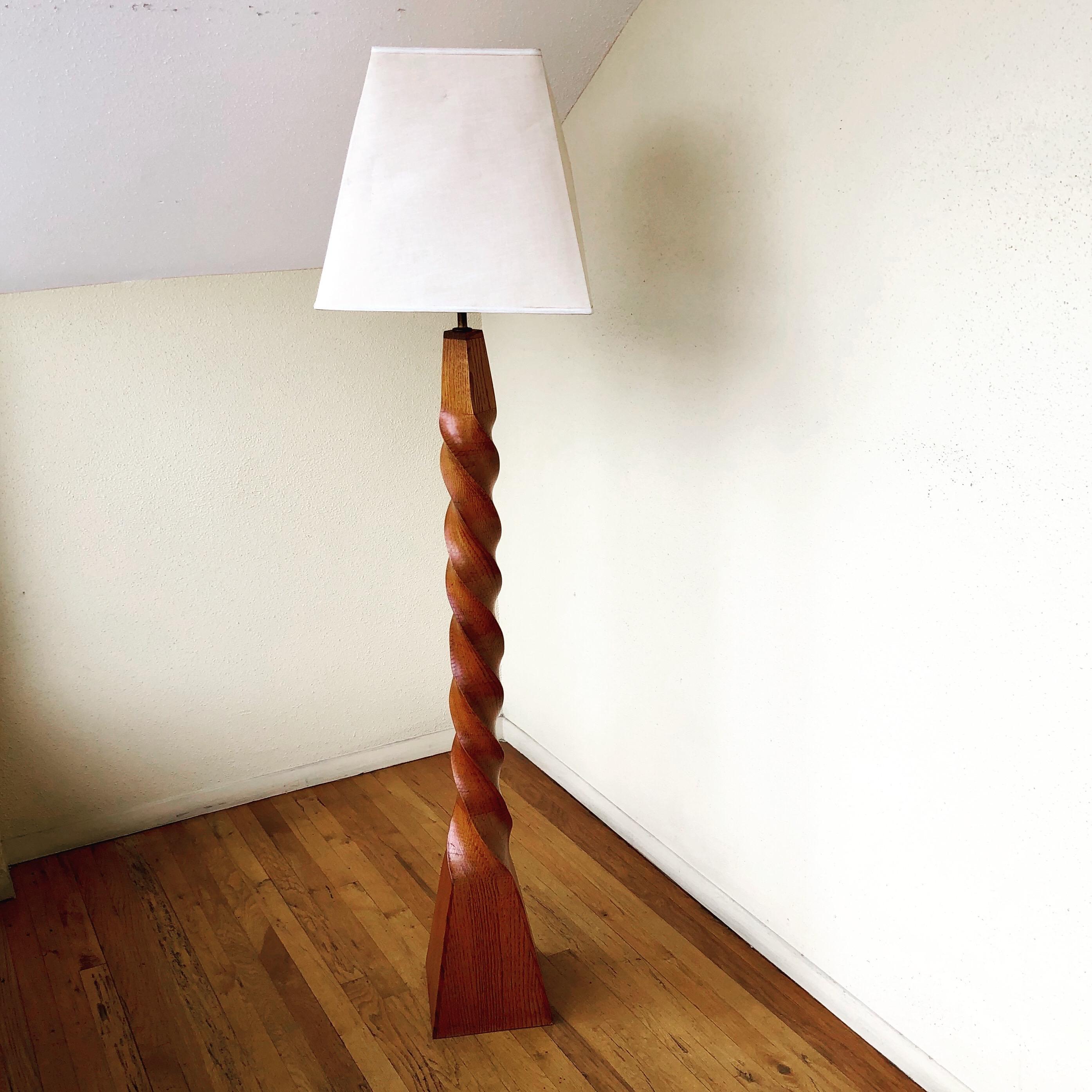 One of a kind sculpted wood floor lamp, incredible detail the lamp tapers from bottom to top, the lampshade is not included due to condition. The lamp its 68