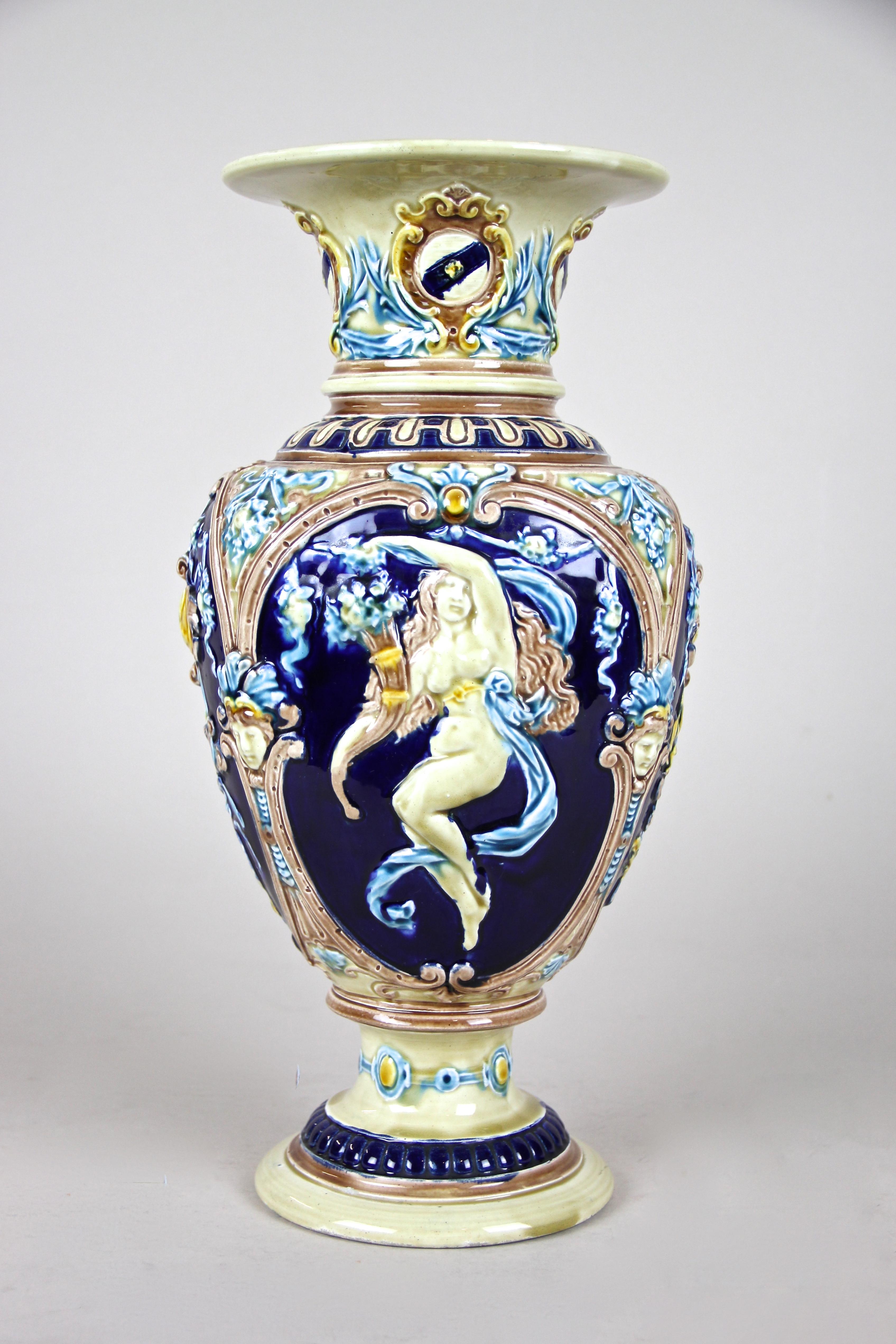 Lovely Art Nouveau Majolica Amphora vase out of the renown manufactory of Schuetz Cilli in Slovenia circa 1900. This colorful Majolica masterpiece impresses with a unique shape and beautiful design. The bulbous body depicts beautiful women with long