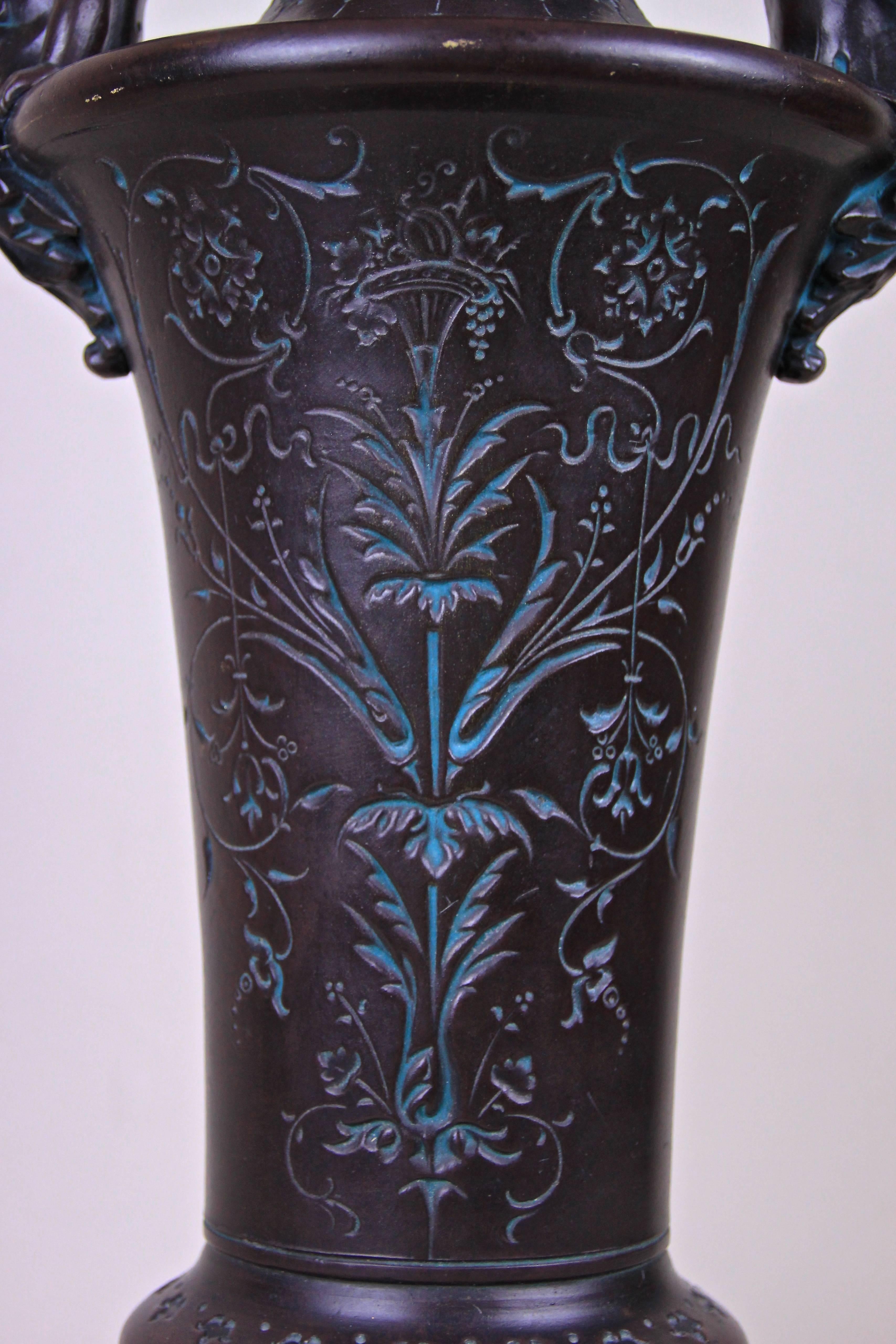 Large, one of a kind Art Nouveau Majolica vase made by the famous majolica/ ceramic manufactory of Bernhard Bloch in Bohemia around 1890. This unique shaped majolica vase is adorned by two lovely 