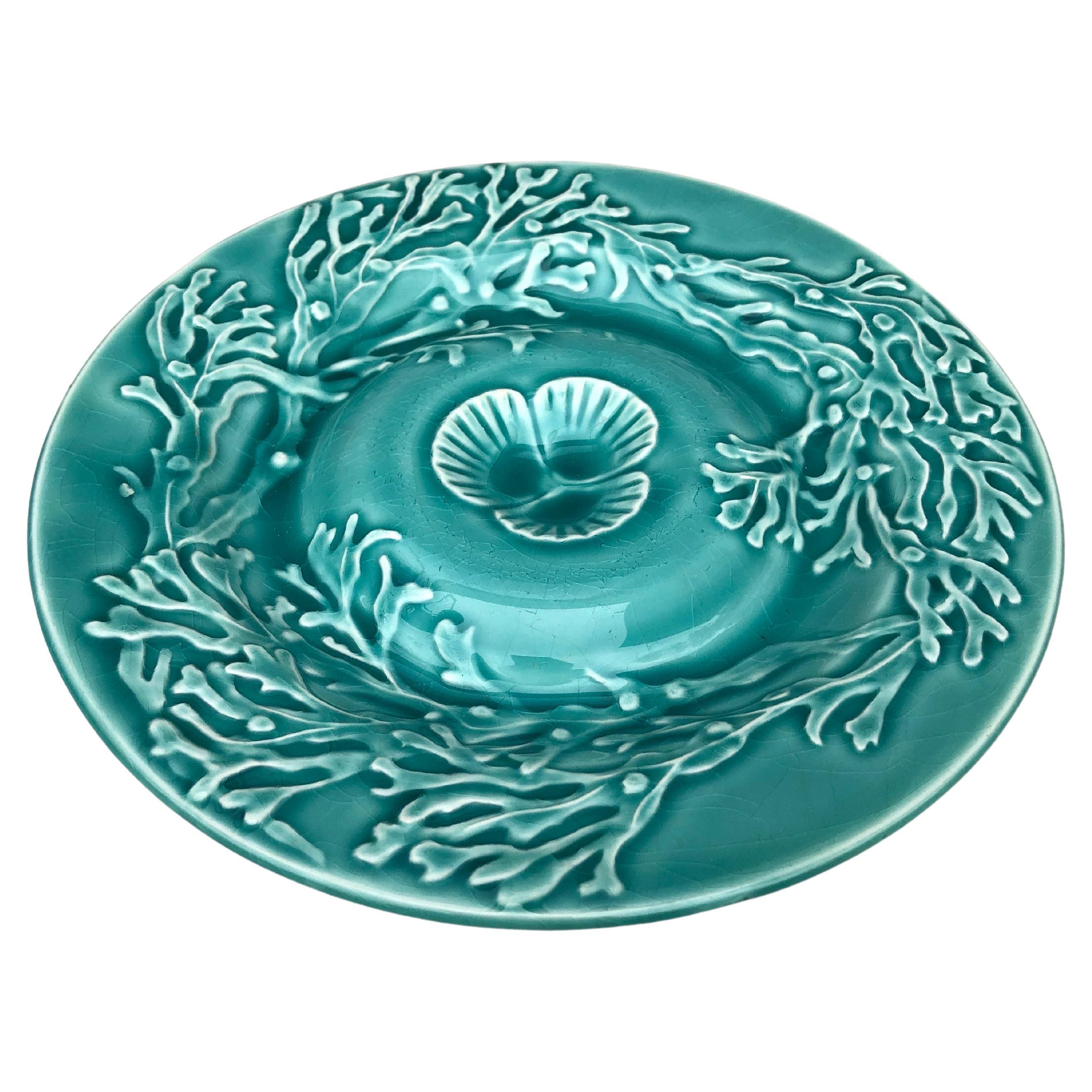 Majolica aqua turquoise shell plate with seaweeds signed Gien, circa 1930.