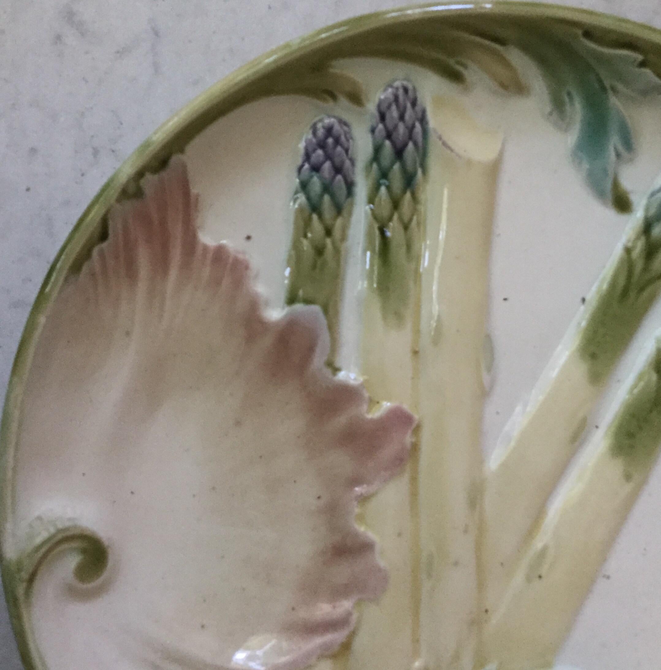 Large Majolica asparagus plate signed Keller et Guerin Luneville, circa 1880.
This plate exist in different colors and sizes this one is the largest size.
A set of smaller size is also available.