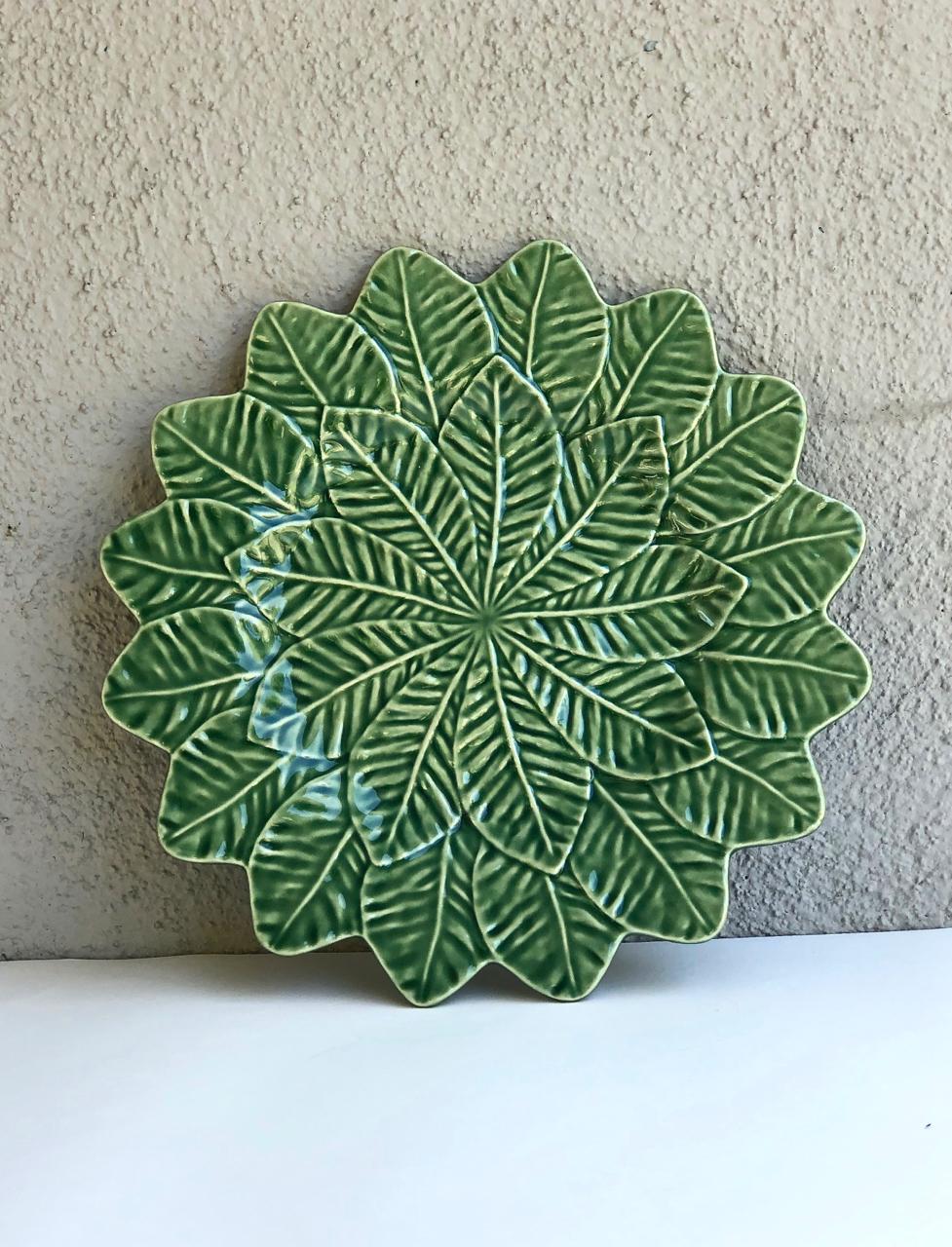 This is an outstanding set of 12 mid-century Bordallo Piniero Portuguese Majolica double leaf incised dinner plates or chargers. The incised double leaf design and leaf-shaped edge of these plates mark them as outstanding works of ceramic art. All