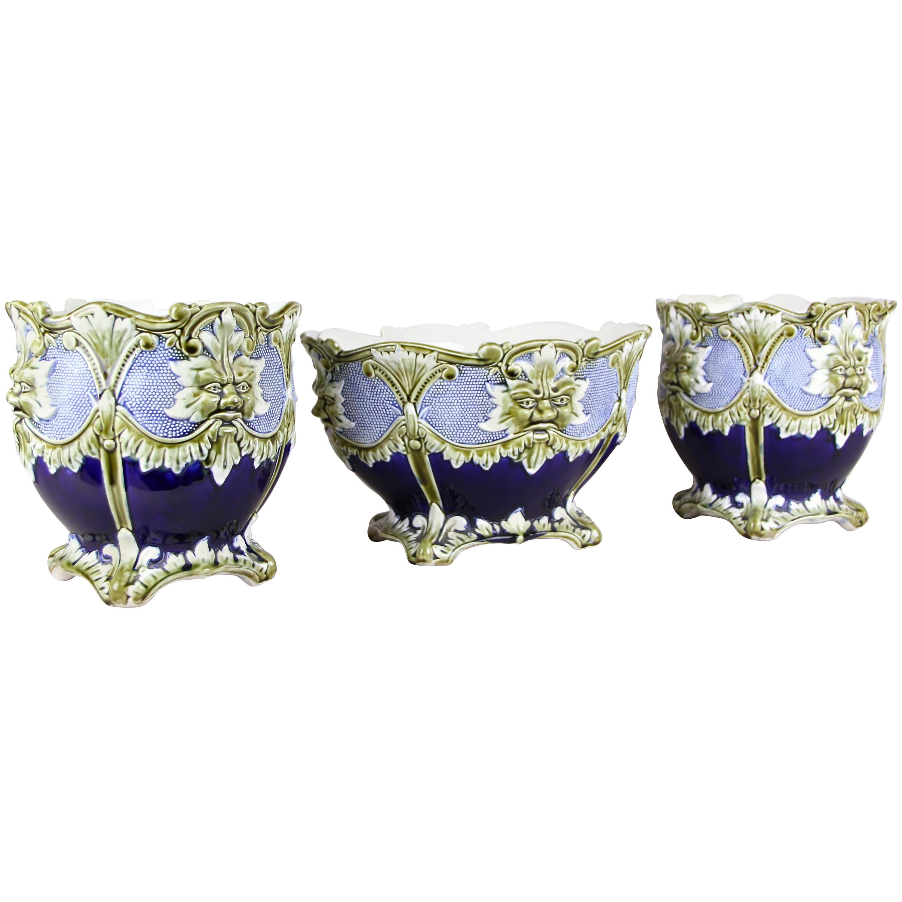 Beautiful Majolica cachepot set of three by J. Bernard De Bruyne. Made in the beginning of the 20th century by the well-known French manufactory, this very decorative cachepot set consists of two similar cachepots and a 