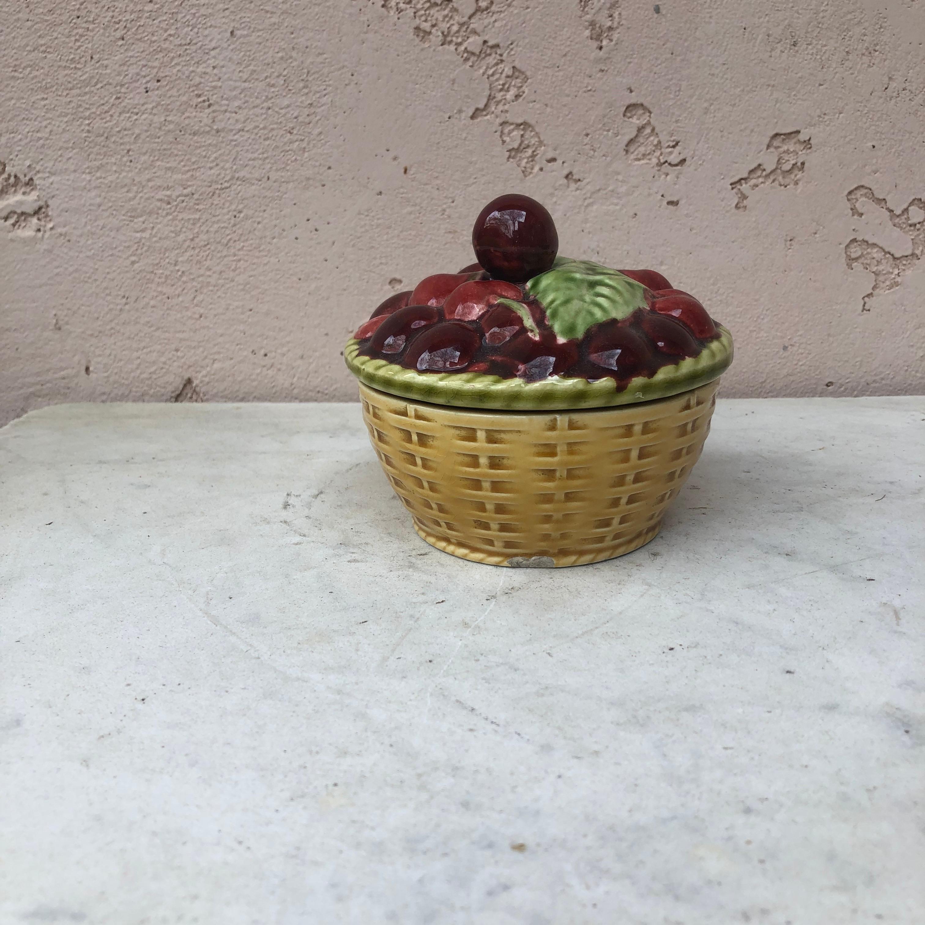 Majolica Trompe l'oeil basket with cherries handle signed Sarreguemines, circa 1920.
 