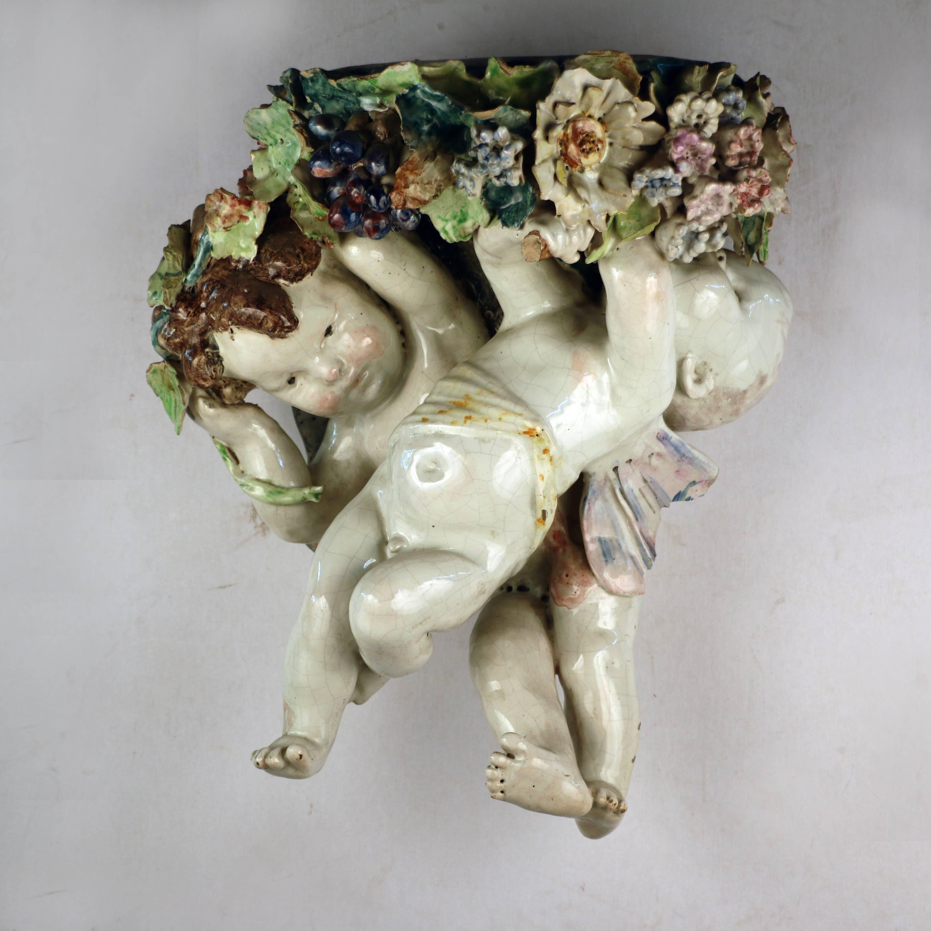 Majolica Cherubs supporting Wall Bracket In Good Condition In Montreal, QC
