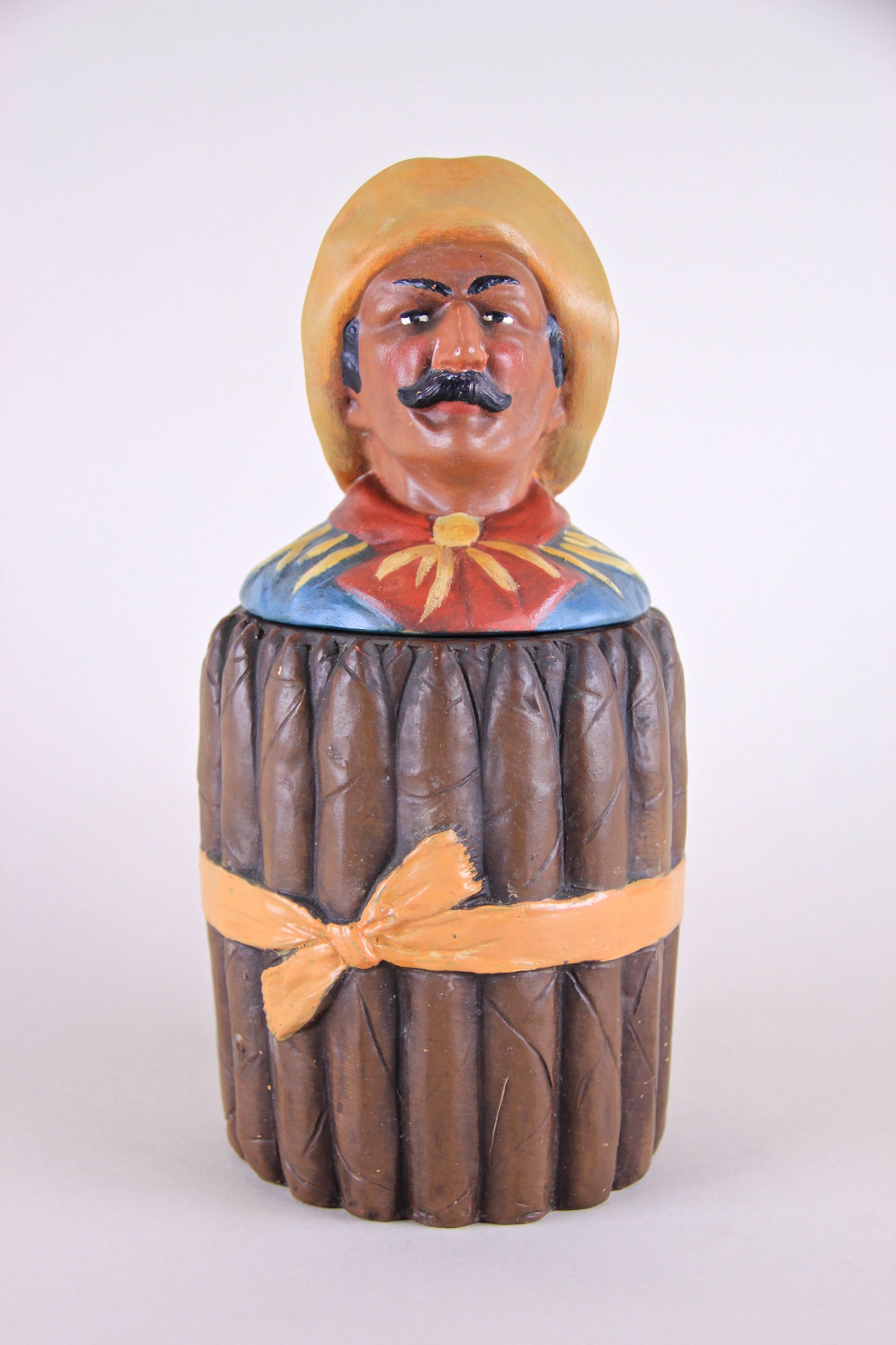 Here we are offering one of our rare Johann Maresch items, an outstanding Majolica Cigar Box from the early 20th century. The unusual worked Cigar Box looks like a bunch of cigars with a with a detachable cover that depicts a funny cuban man with a