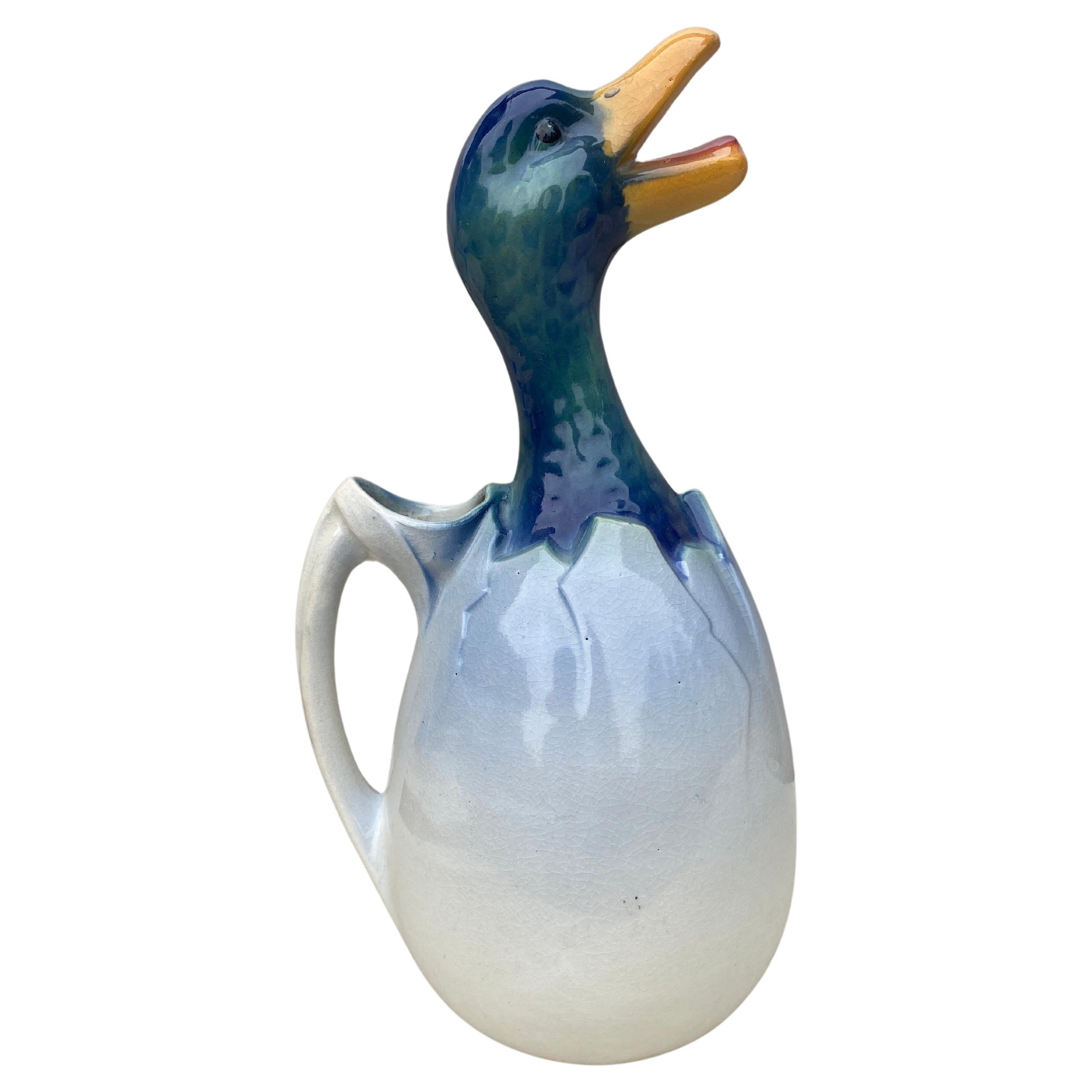 Large Majolica duck in an egg pitcher signed Keller et Guerin Saint Clement, circa 1900.
Decorated with a duckling watching a dragonfly.
