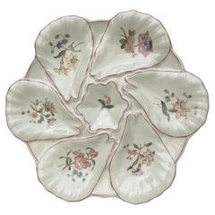 Assiette à huîtres à fleurs en majolique Longchamps, vers 1900