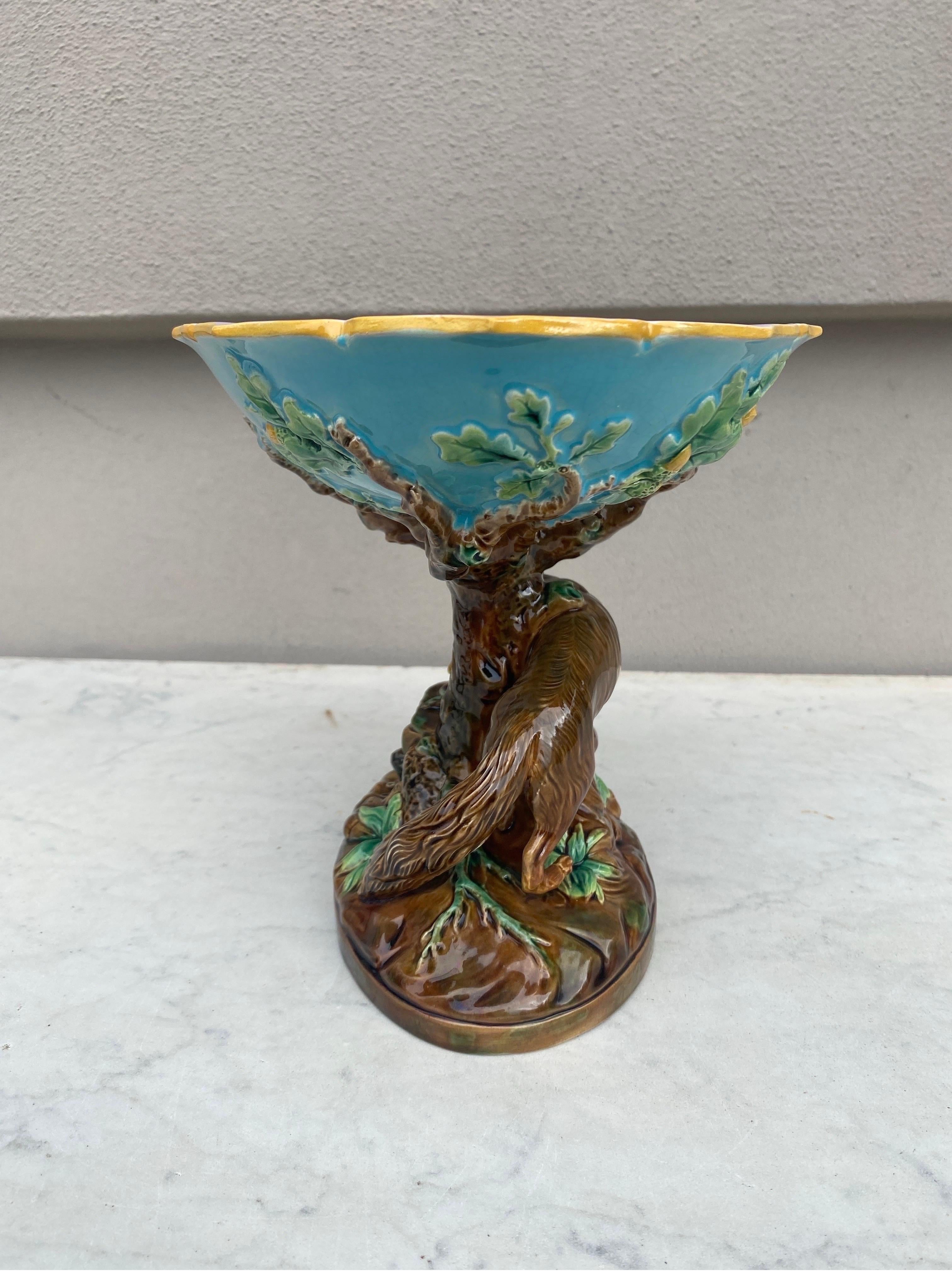 19th-Century fox & rabbit compote or cacke stand signed George Jones.
With a tree trunk supporting an aqua bowl outside and pink inside decorated with oak leaves.
Ilustrated in the book of Dawes page 116.
  