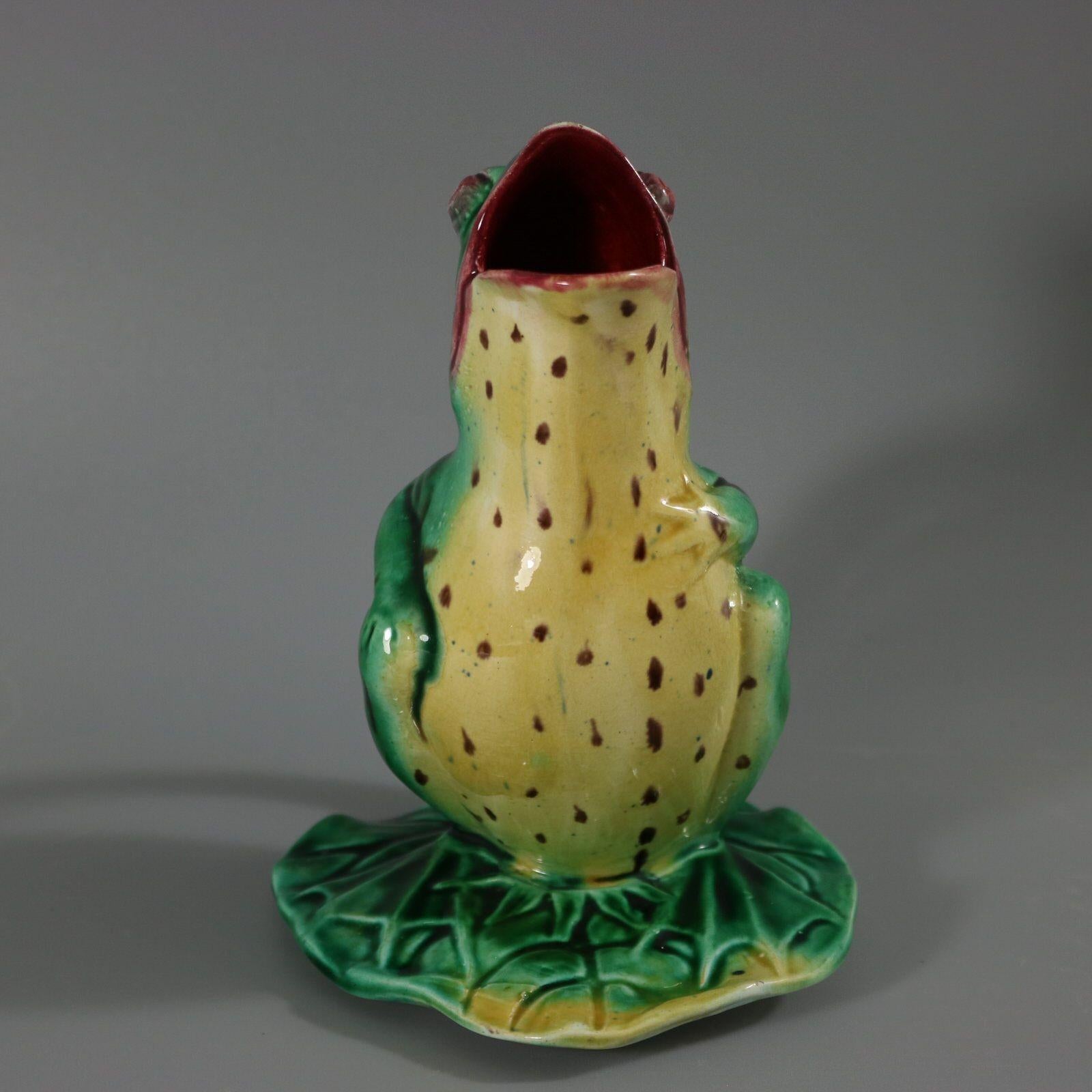 Majolica jug/pitcher which features a frog sitting on a lily pad. Colouration: green, yellow, brown, are predominant. Bears a pattern number, '3'.