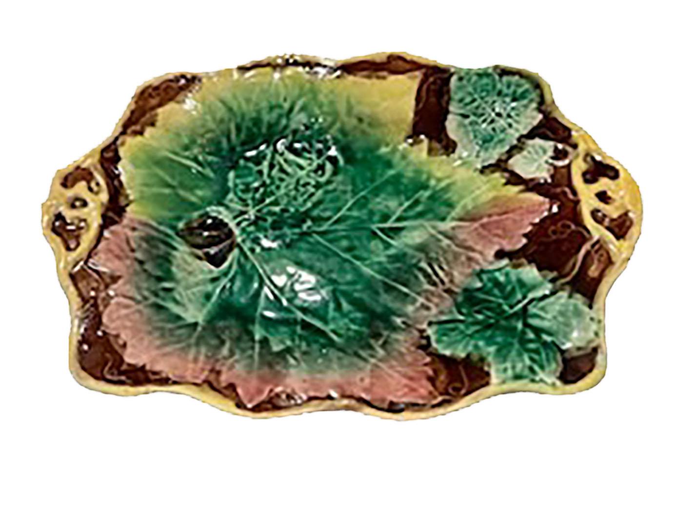 A green Majolica dish with a beautiful leaf in the center. English, circa 1890s. 
