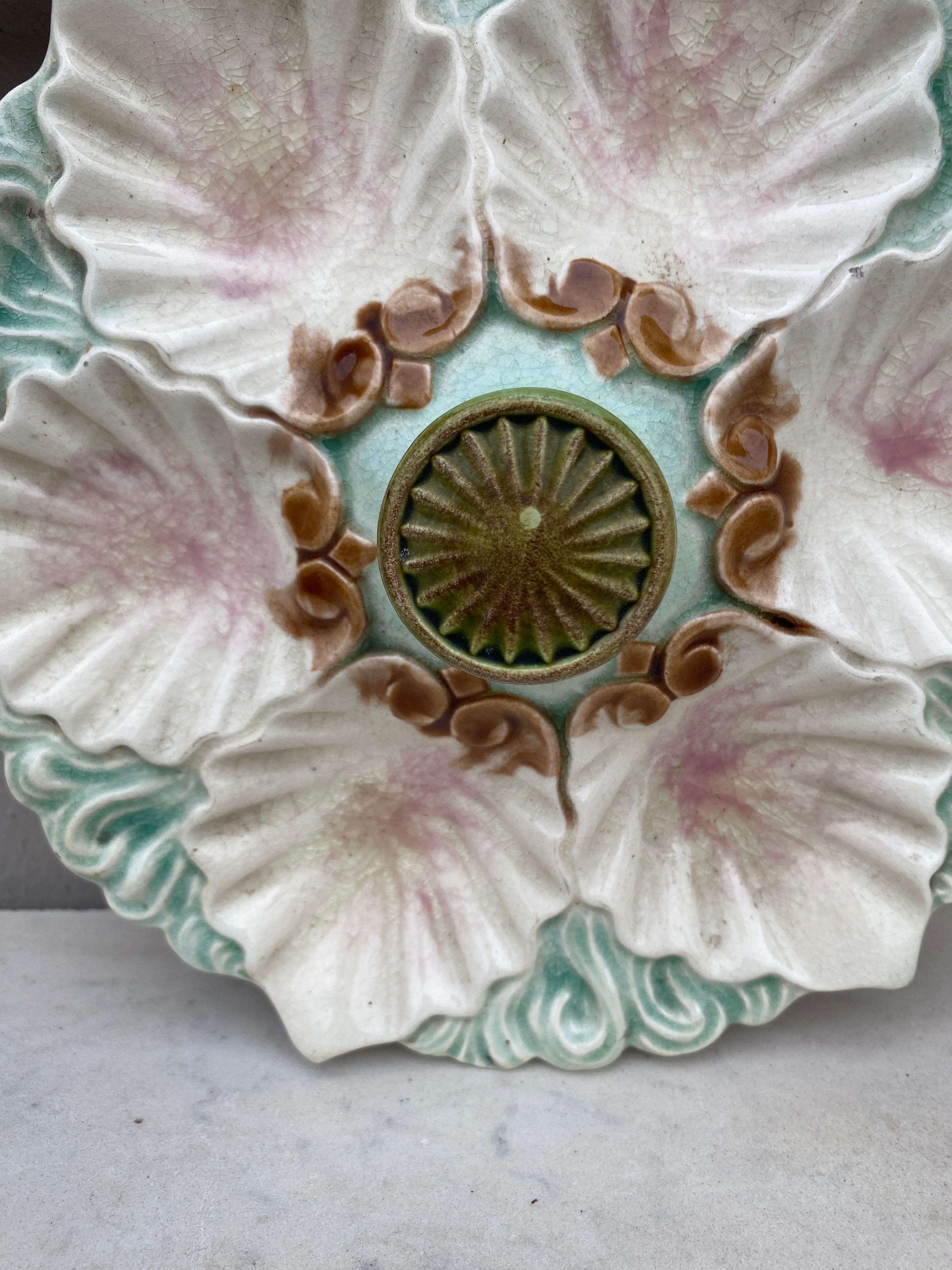 Majolica handled oyster plate with handle on the center from Orchies, circa 1890. Chip on the back.