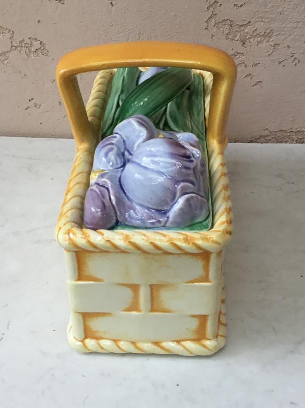 Large Majolica basket with iris flowers signed Sarreguemines, circa 1920.
