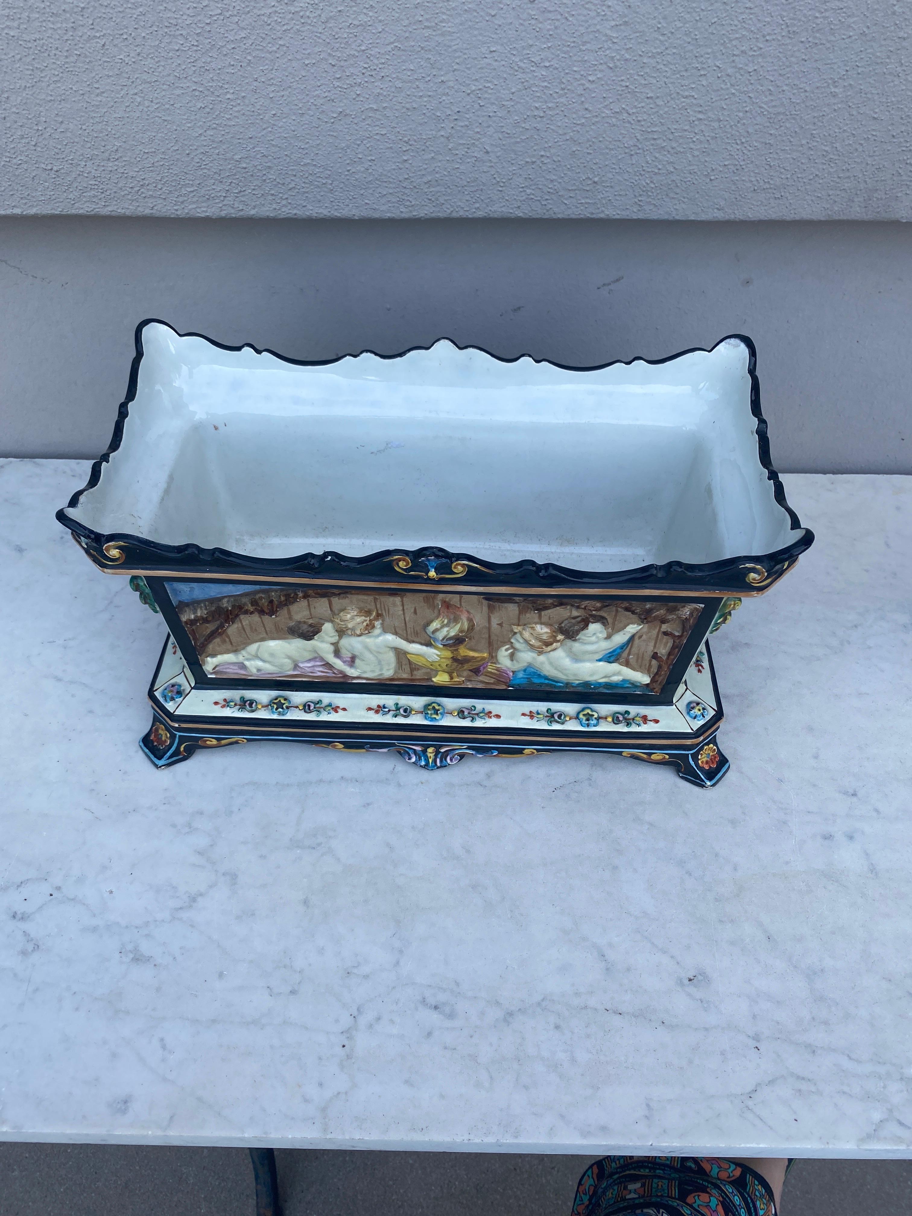 Majolica Jardinière with Puttis Montereau circa 1860 In Good Condition For Sale In Austin, TX