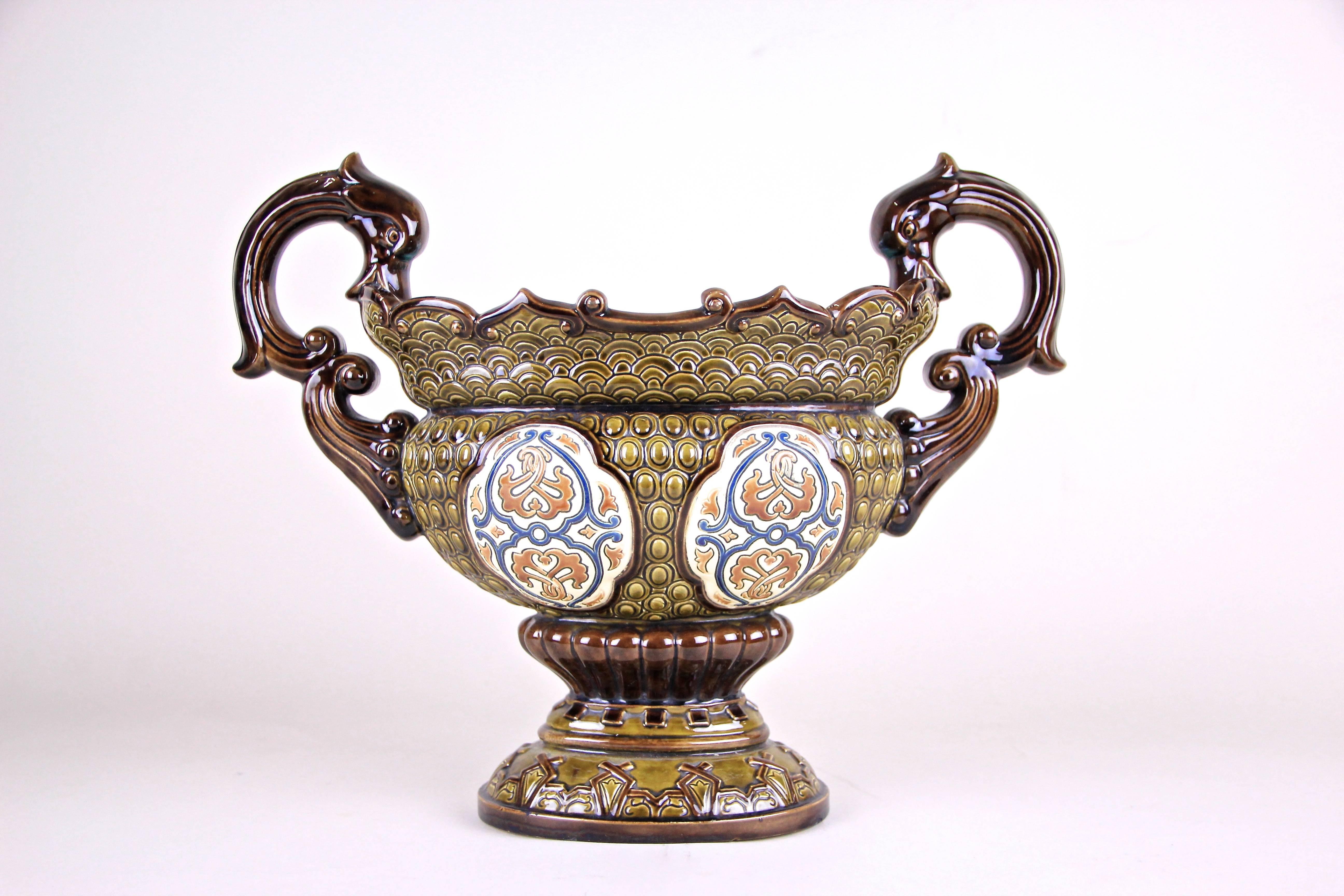This beautiful Majolica Jardinière by Gerbing & Stephan comes with an amazing worked design and was produced by in the famous ceramic/ majolica manufacturer circa 1890. Beautiful warm earth tones and hand painted applications on both sides are