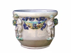 Majolica Nymphenburg handcrafted and hand painted planter with relief of cherubs