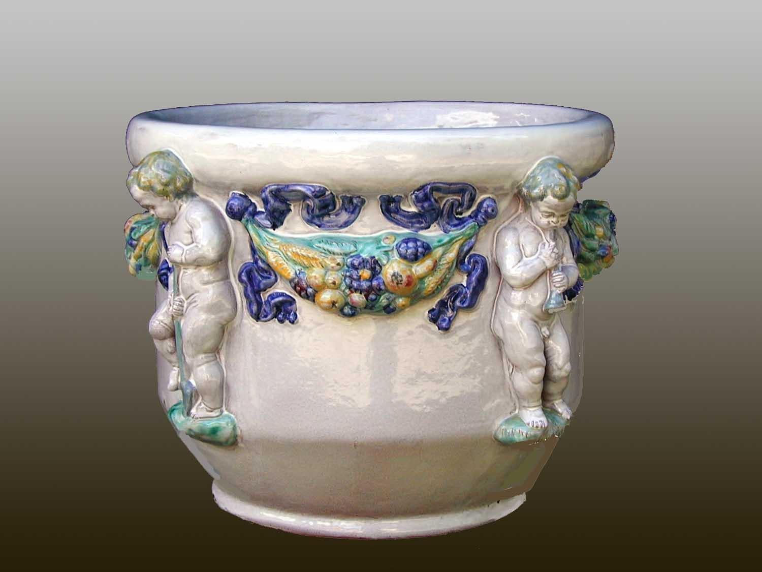 Mid-Century Modern Majolica Nymphenburg handcrafted and hand painted planter with relief of cherubs For Sale