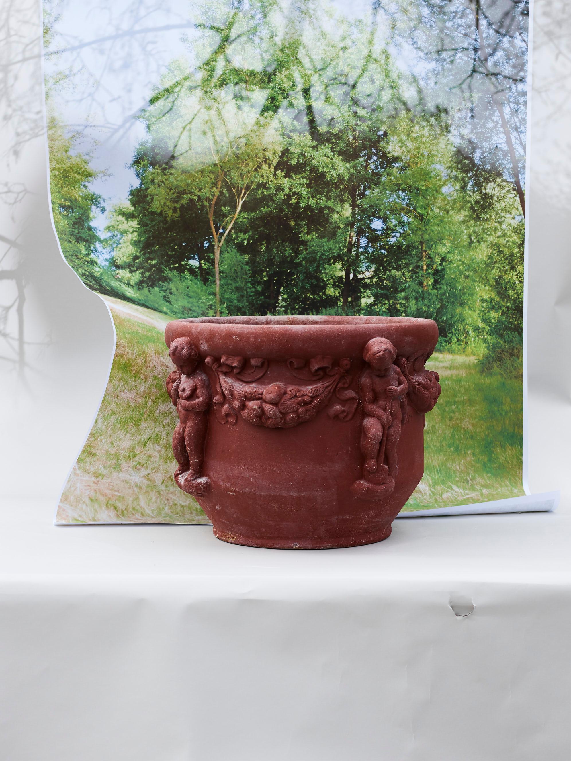 German Majolica Nymphenburg handcrafted and hand painted planter with relief of cherubs For Sale
