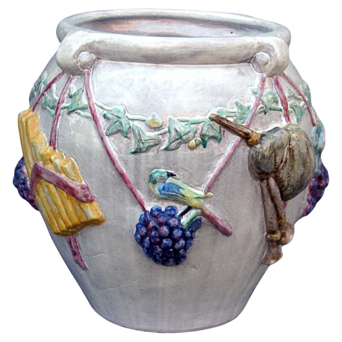 Majolica Nymphenburg handcrafted and hand painted planter with relief of cherubs For Sale