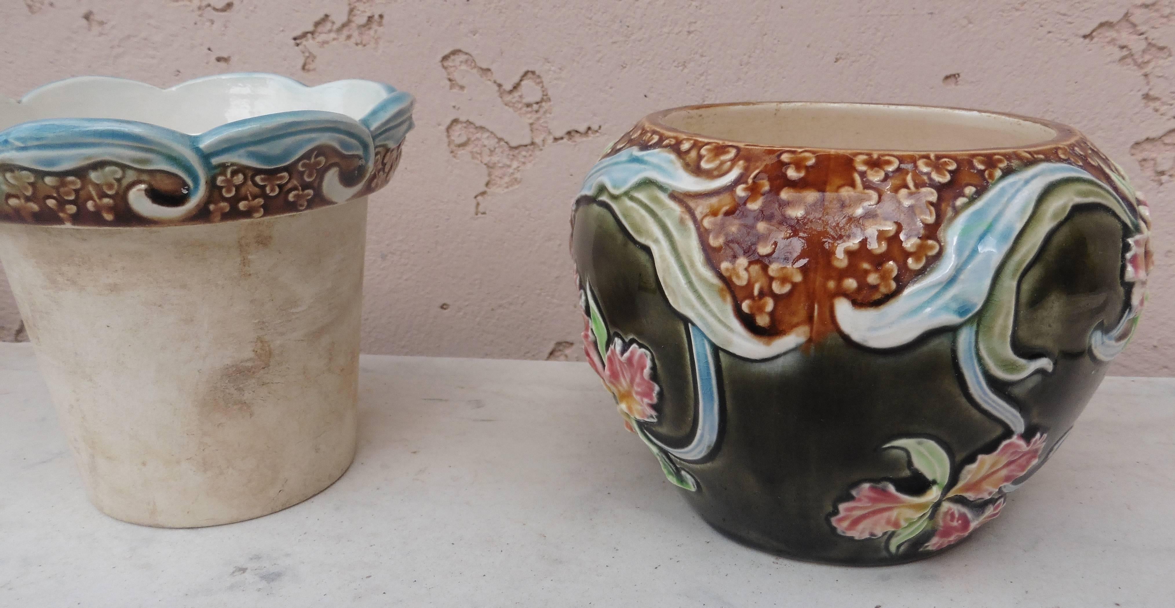 Lovely small Majolica jardinière in two pieces decorated with orchids signed Fives Lille, circa 1900.