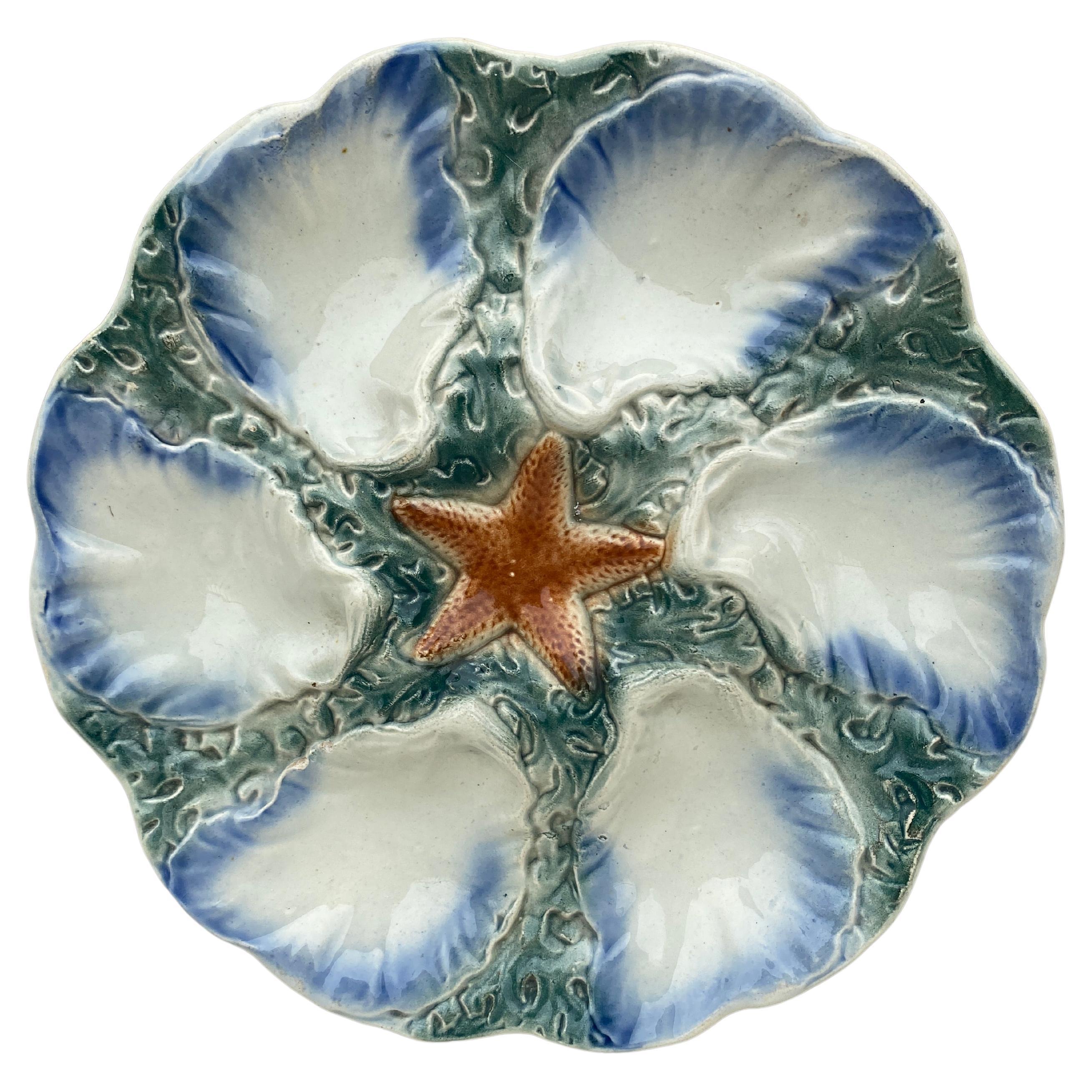 Assiette étoile d'huître bleue en majolique Digoin, vers 1900