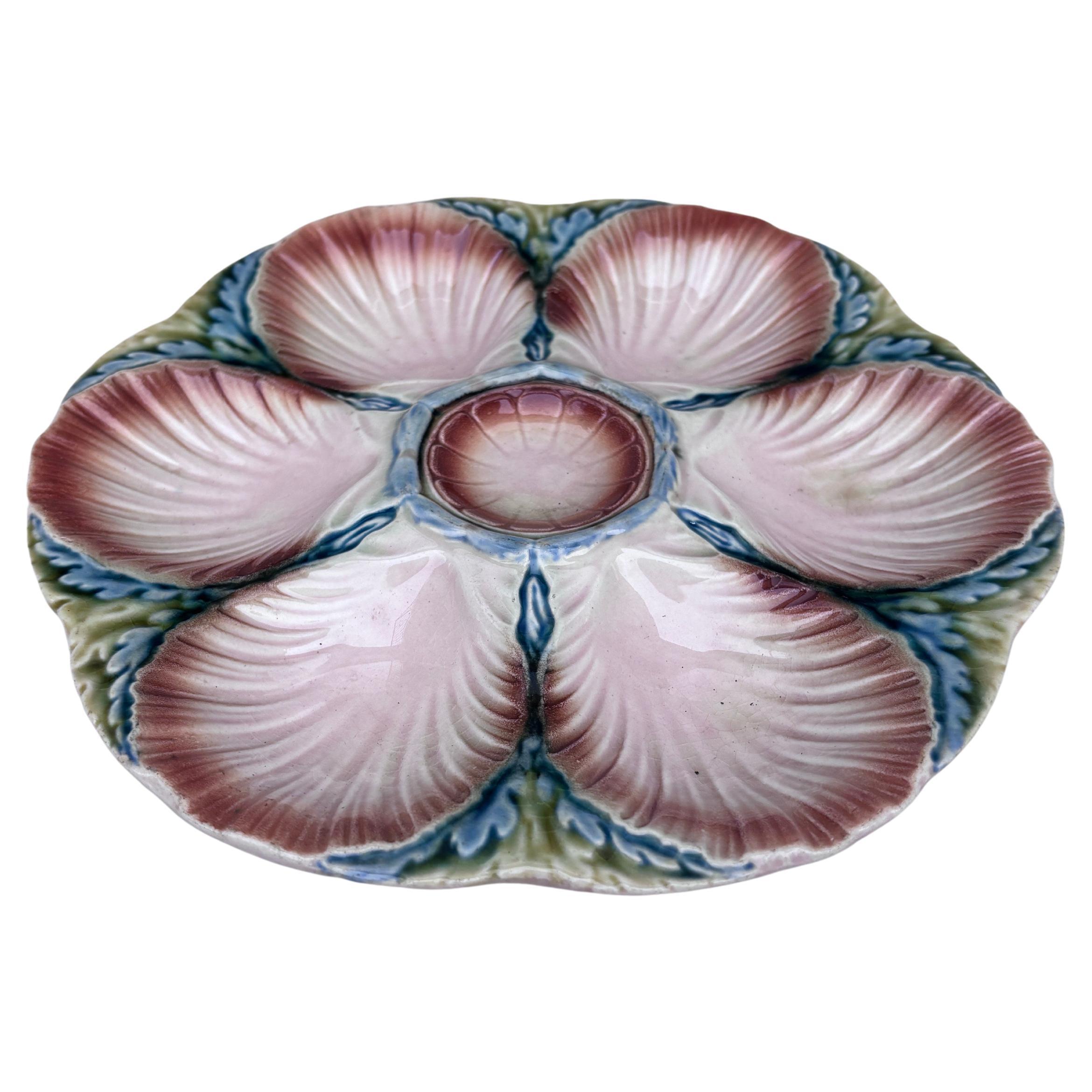 Majolica oyster plate Sarreguemines, circa 1920.
6 shells and space for the lemon on the center.