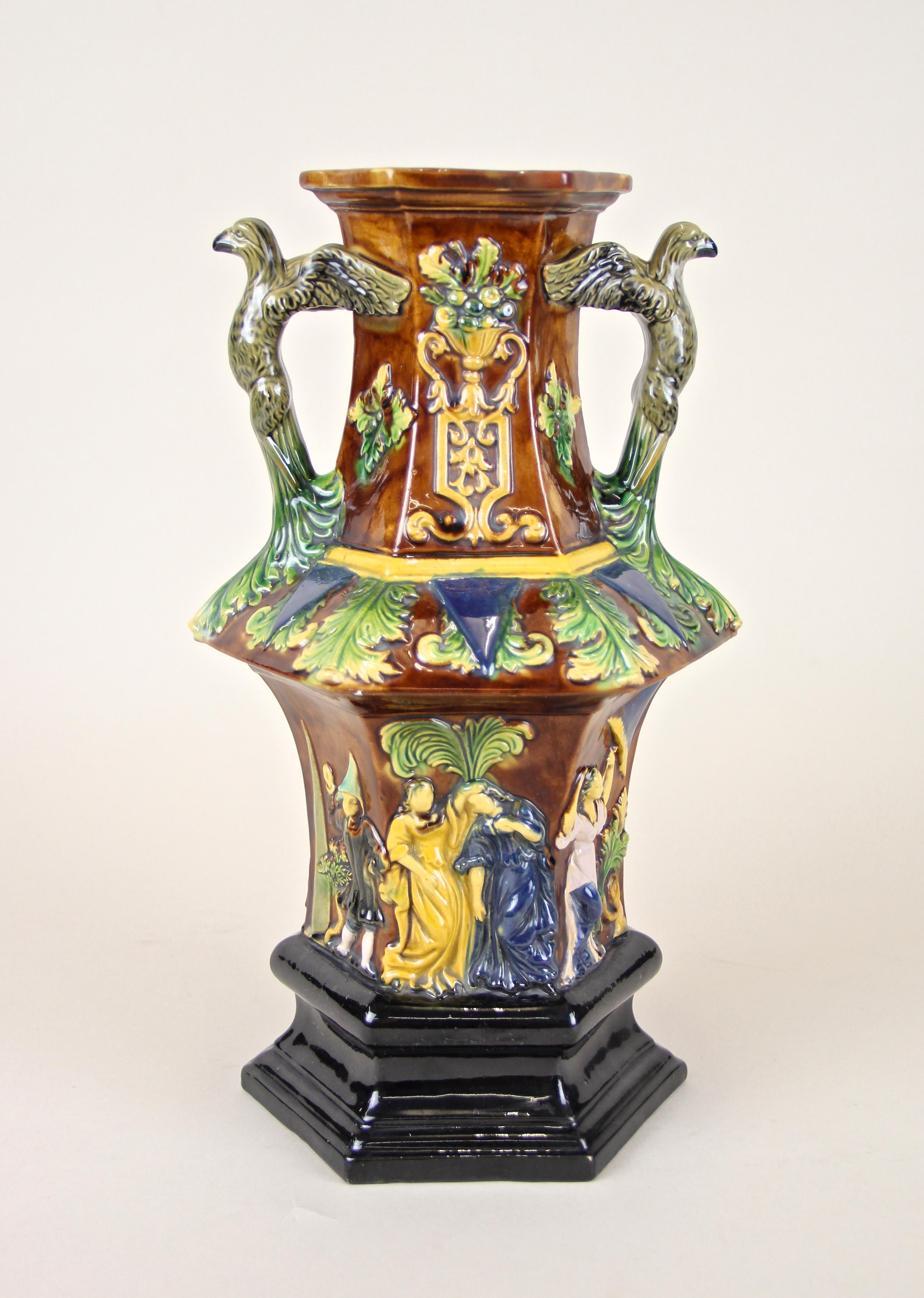 From circa 1860 out of Bohemia comes this lovely colorful Majolica pagoda vase from the famous company of Wilhelm Schiller & Son. A unique shaped, wonderfully colored body in dark brown and black base, shows a fantastic design with foliage and
