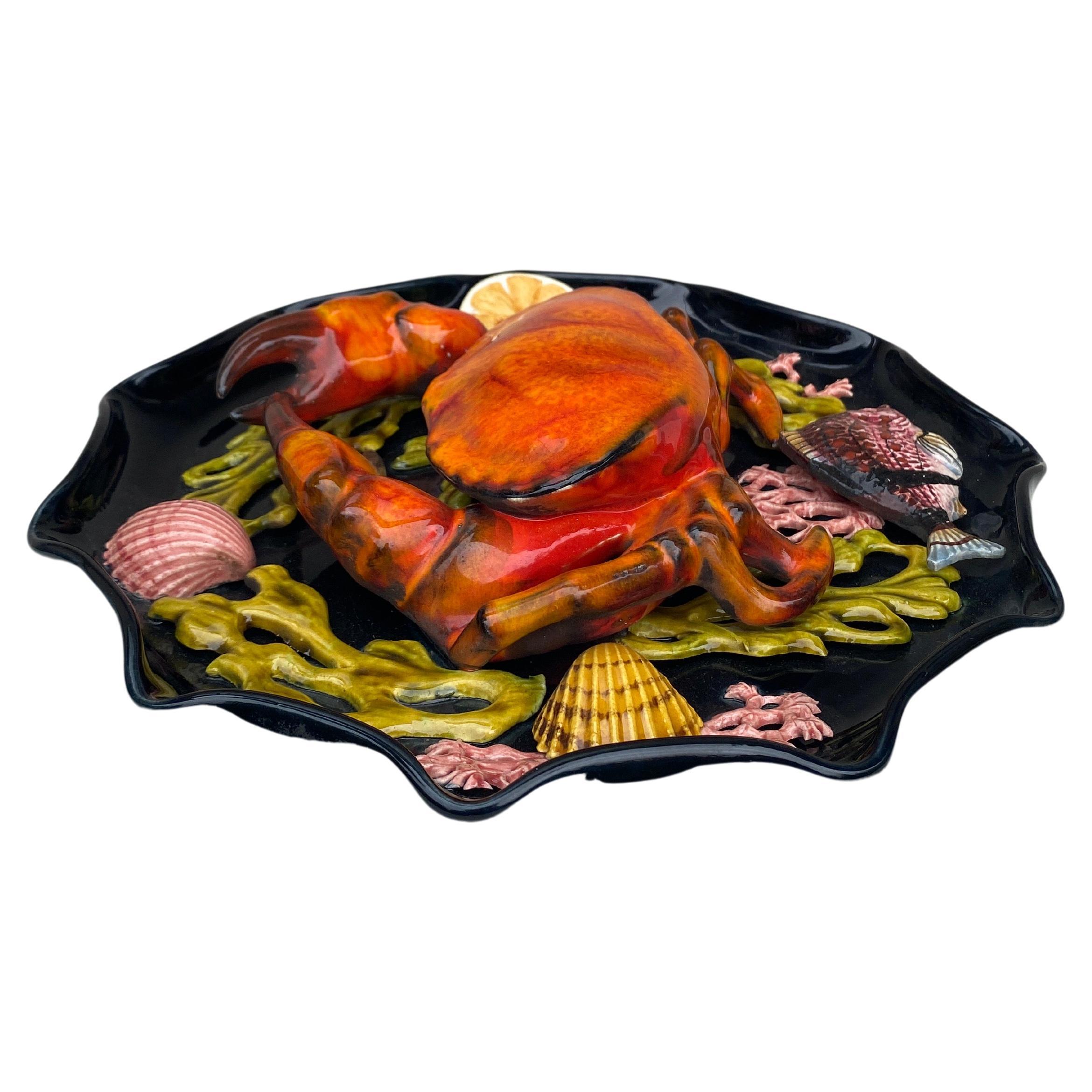 Large Majolica wall platter Vallauris, circa 1950.
A large crab in high relief on the center surrounded by seaweeds, one fish, shells and a slice of lemon.