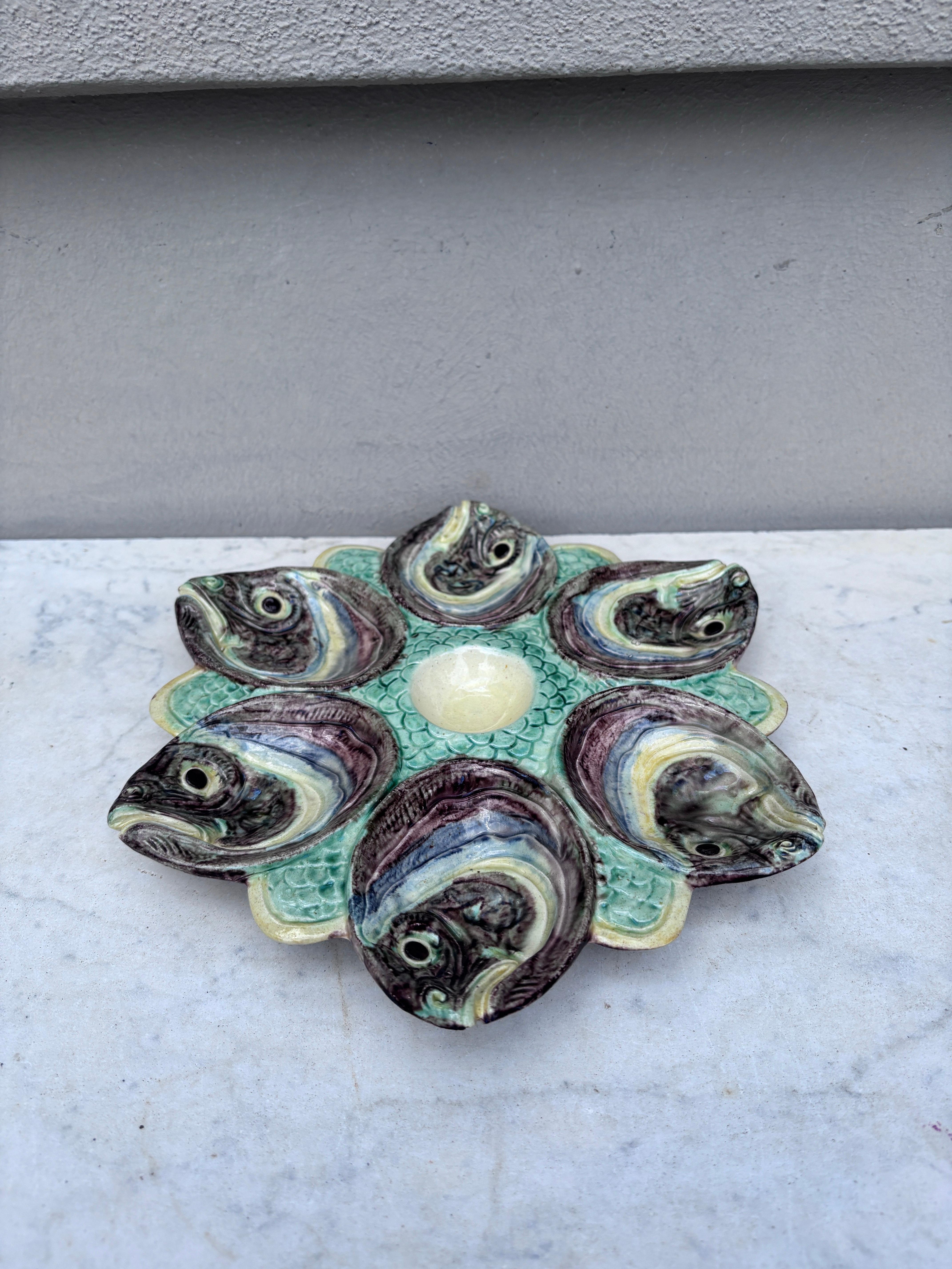 Rare Majolica Palissy oyster plate attributed to Thomas Sergent with fishs heads, circa 1880.