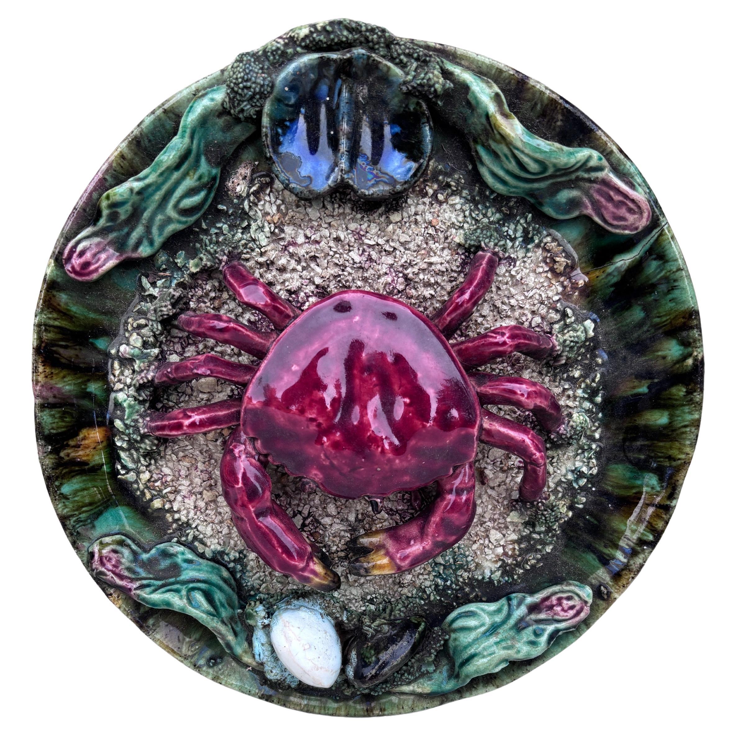 Majolica faience Palissy Portuguese crab platter circa 1940.
Decorated with mussels and shells,
Caldas da Rainha.
9.8 inches diameter.
Hairline on the back.
 