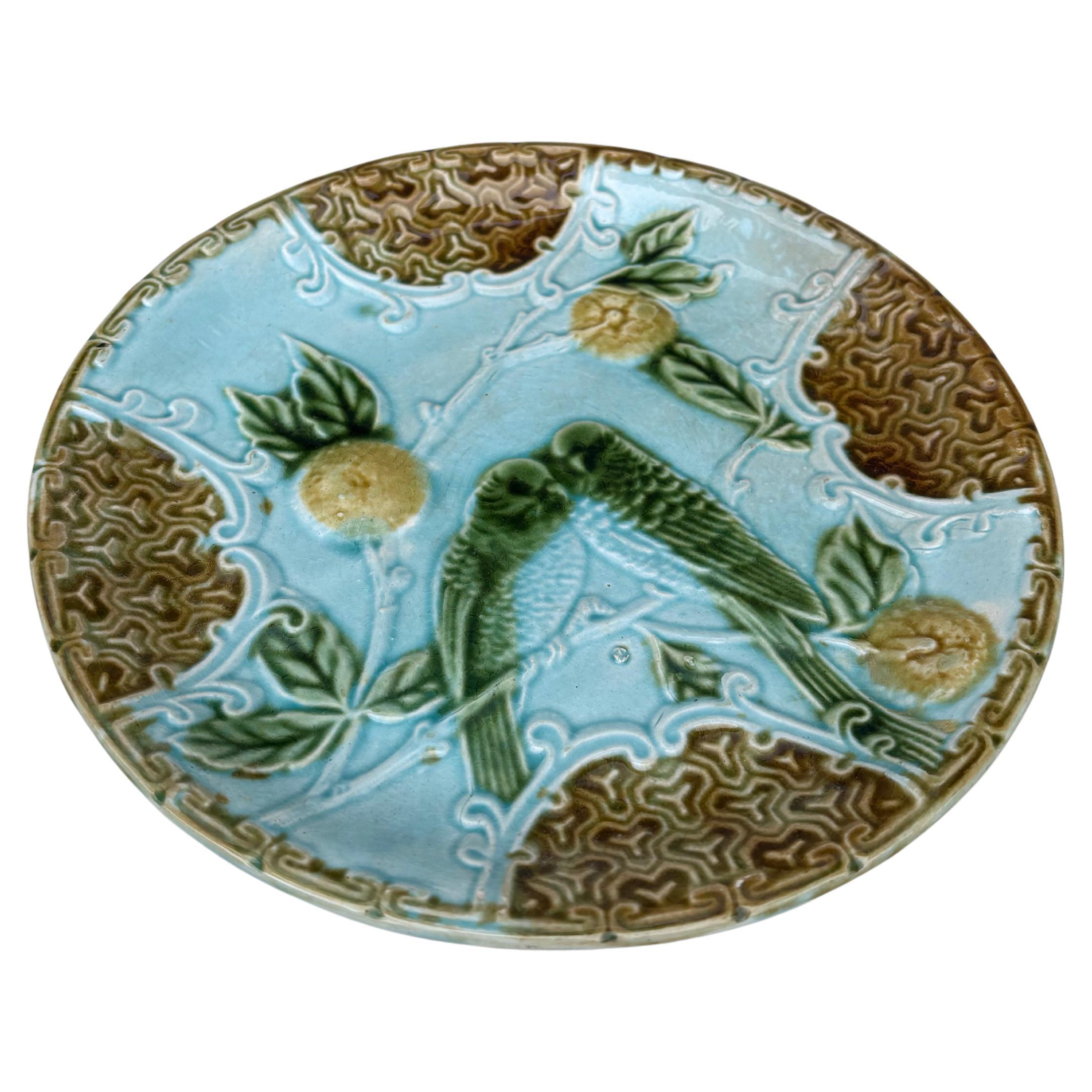 Plato de mayólica dos periquitos sobre fondo azul con naranjas Salins, hacia 1890.
 