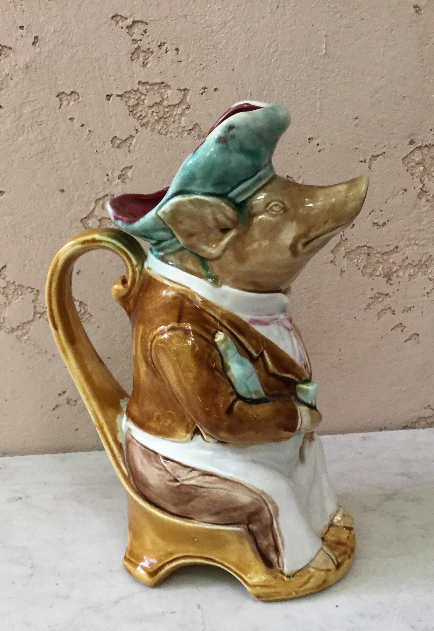French Majolica pig dressed as a waiter signed Onnaing, circa 1900.
Reference / 
