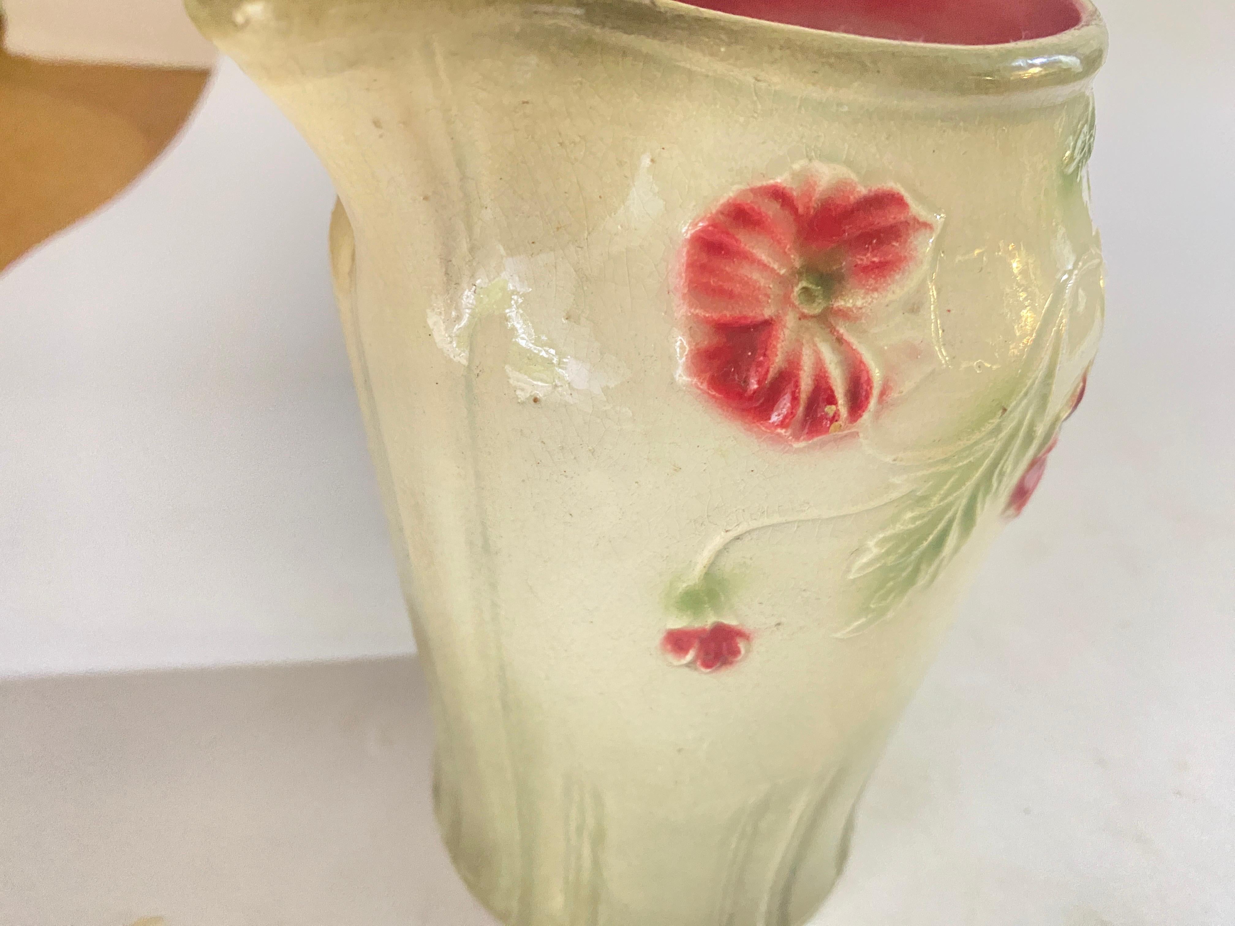 Water lily pitcher. Designed with large green leaves, water lily flowers. The top neck with handle circa 1900.
Brown Yellow and Green colors made in France.