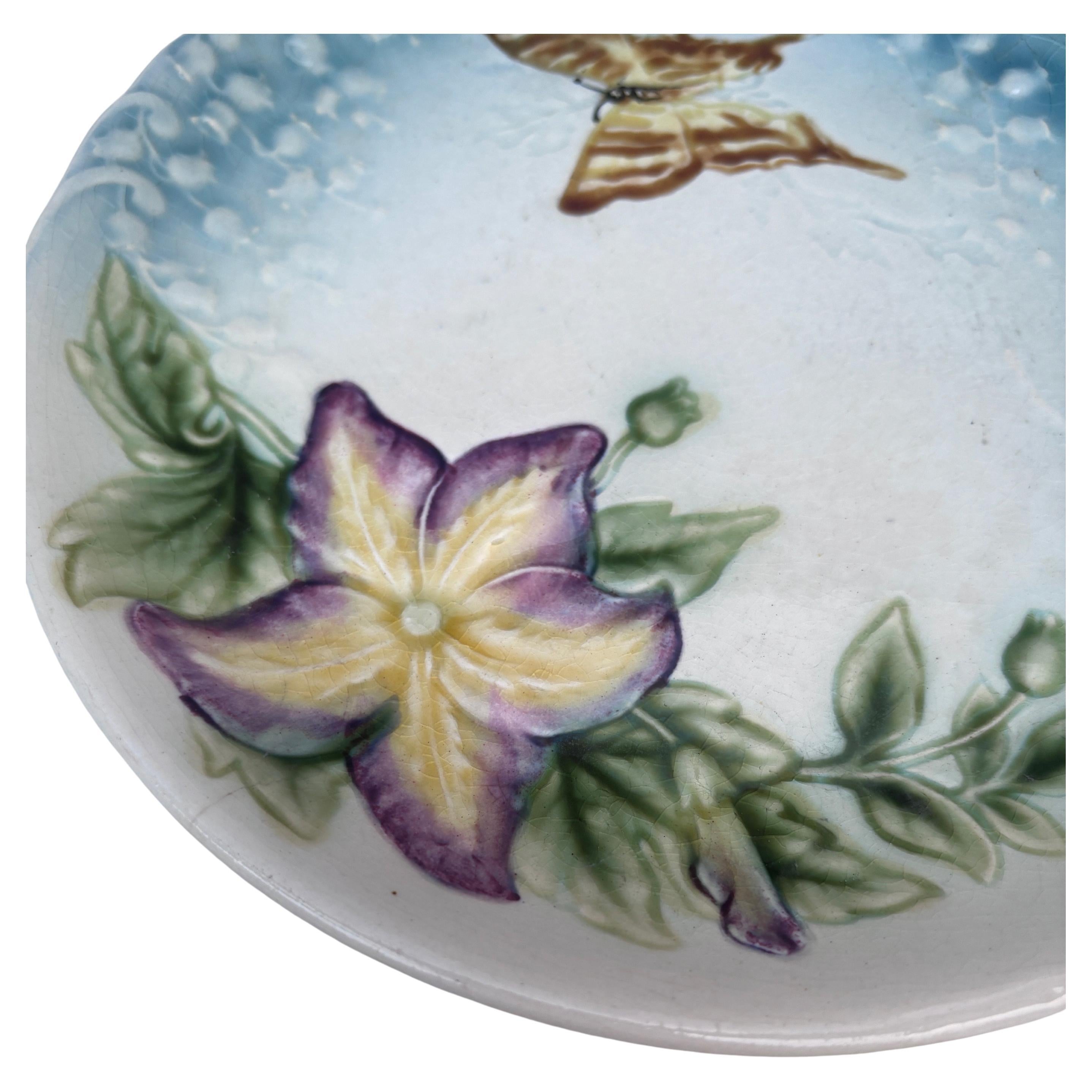 Majolica Plate Purple Flower & Butterfly Choisy le Roi, circa 1880.
Baby blue background with lily of the valley.
8 inches diameter.