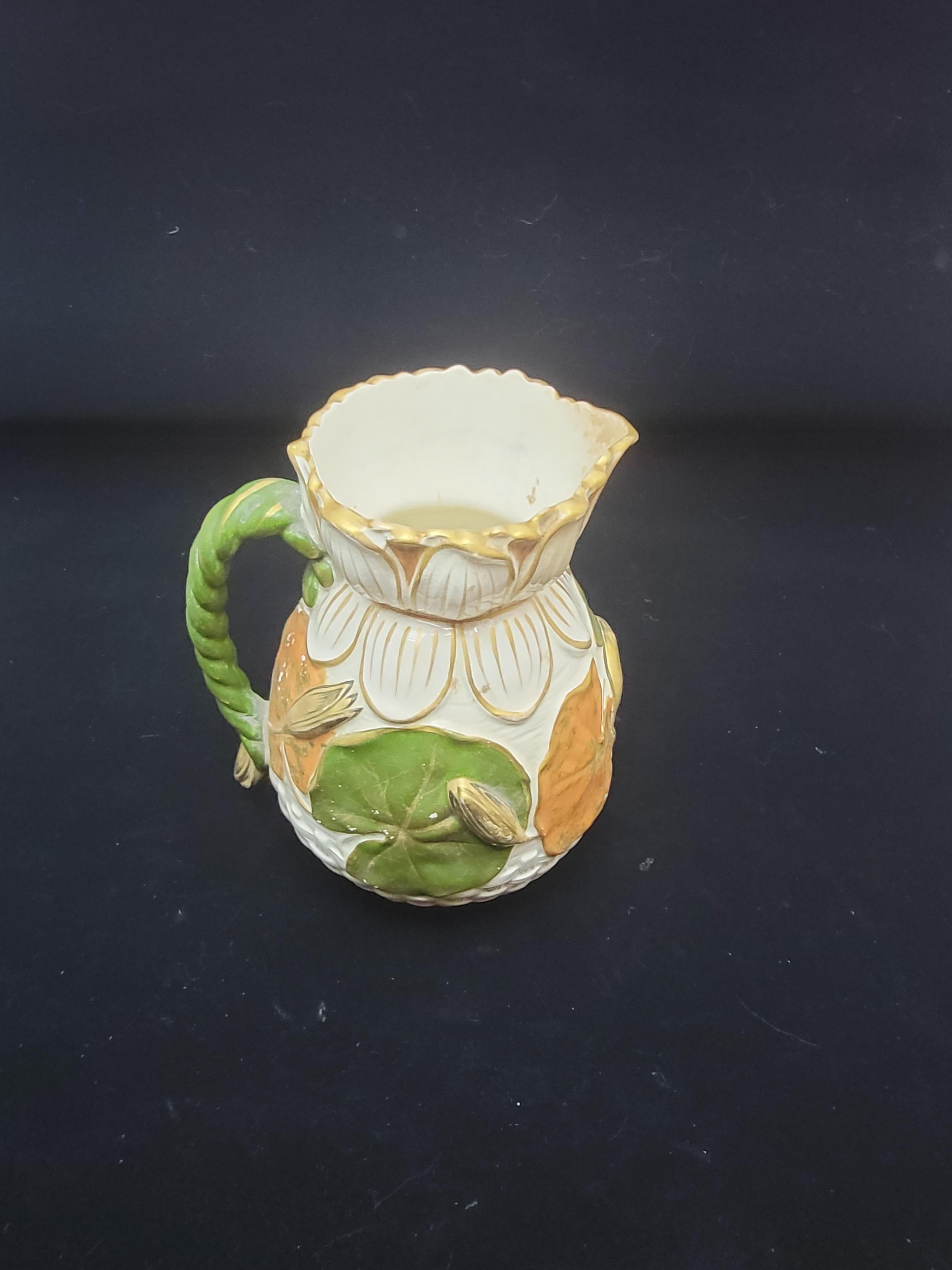 This a most unusual combination for a parianware soft paste pottery in the Majolica family. It is highbrow decoration belies its simpler origins. I have seen this vase in two other finishes but neither one was like this. It is marked as well as a
