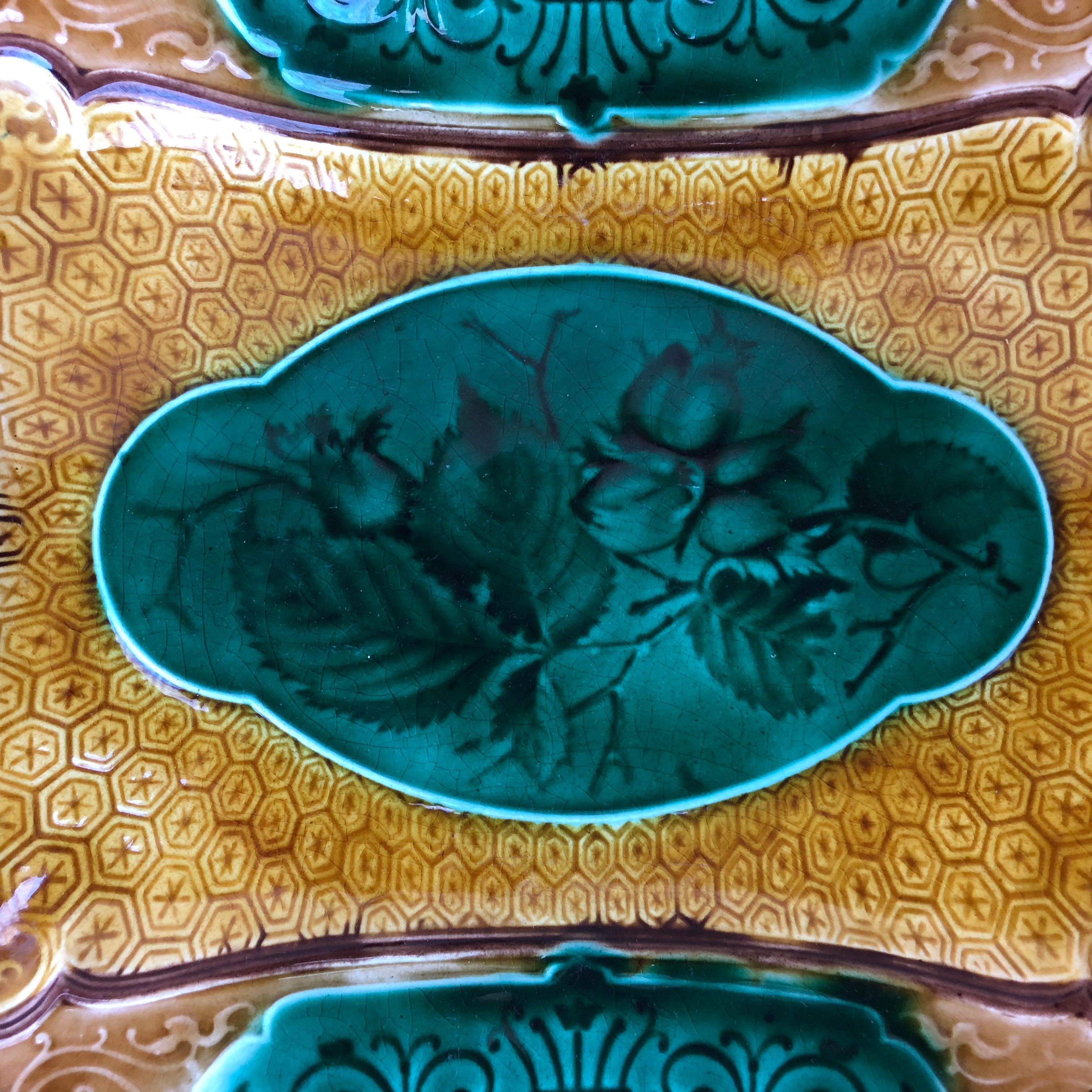 Large Majolica rectangular platter decorated with geometric pattern around a central cartouche with hazelnuts signed Sarreguemines Majolica, circa 1870.