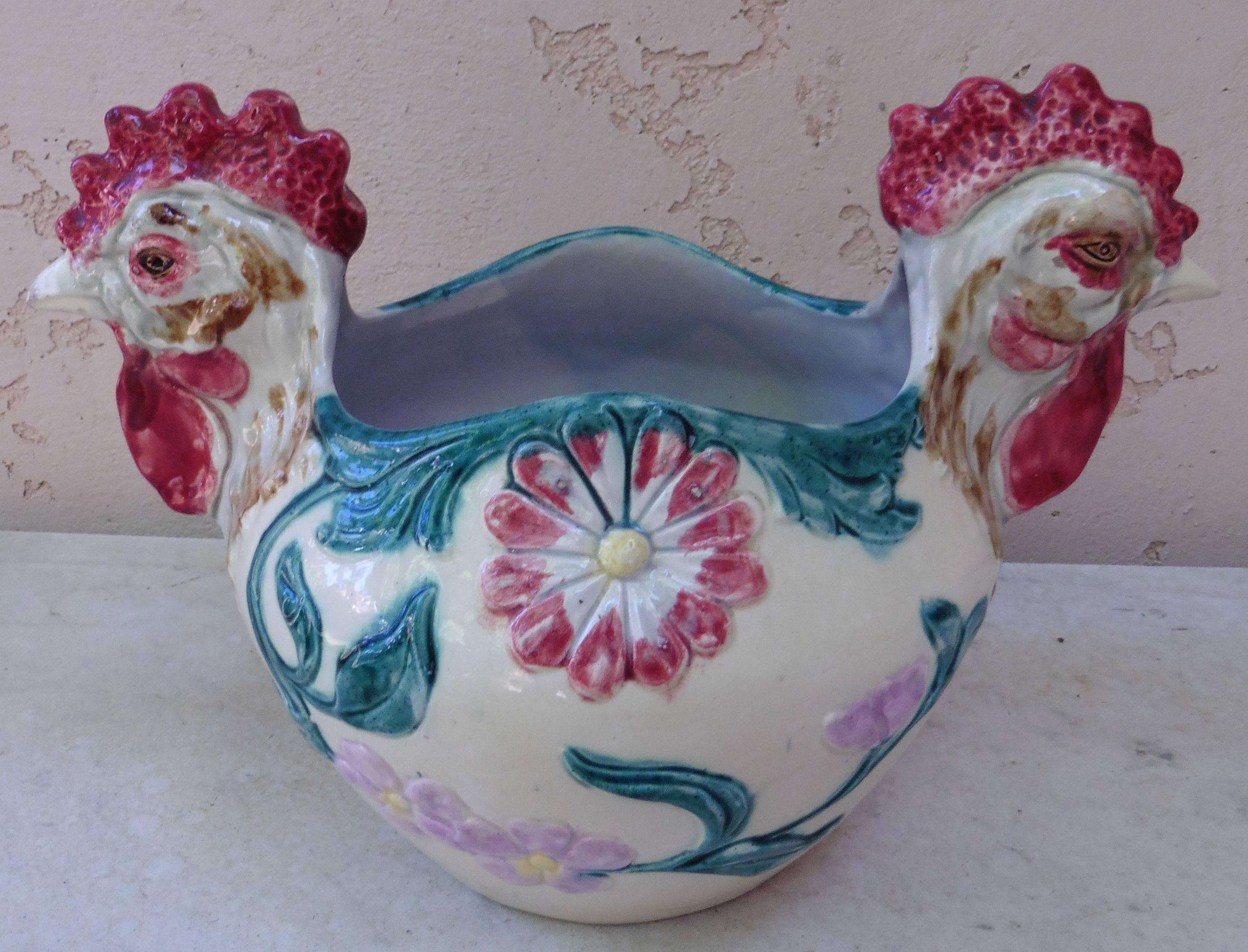 Rustic Majolica ceramic jardiniere with two roosters heads and flowers, circa 1900, Orchies unsigned.