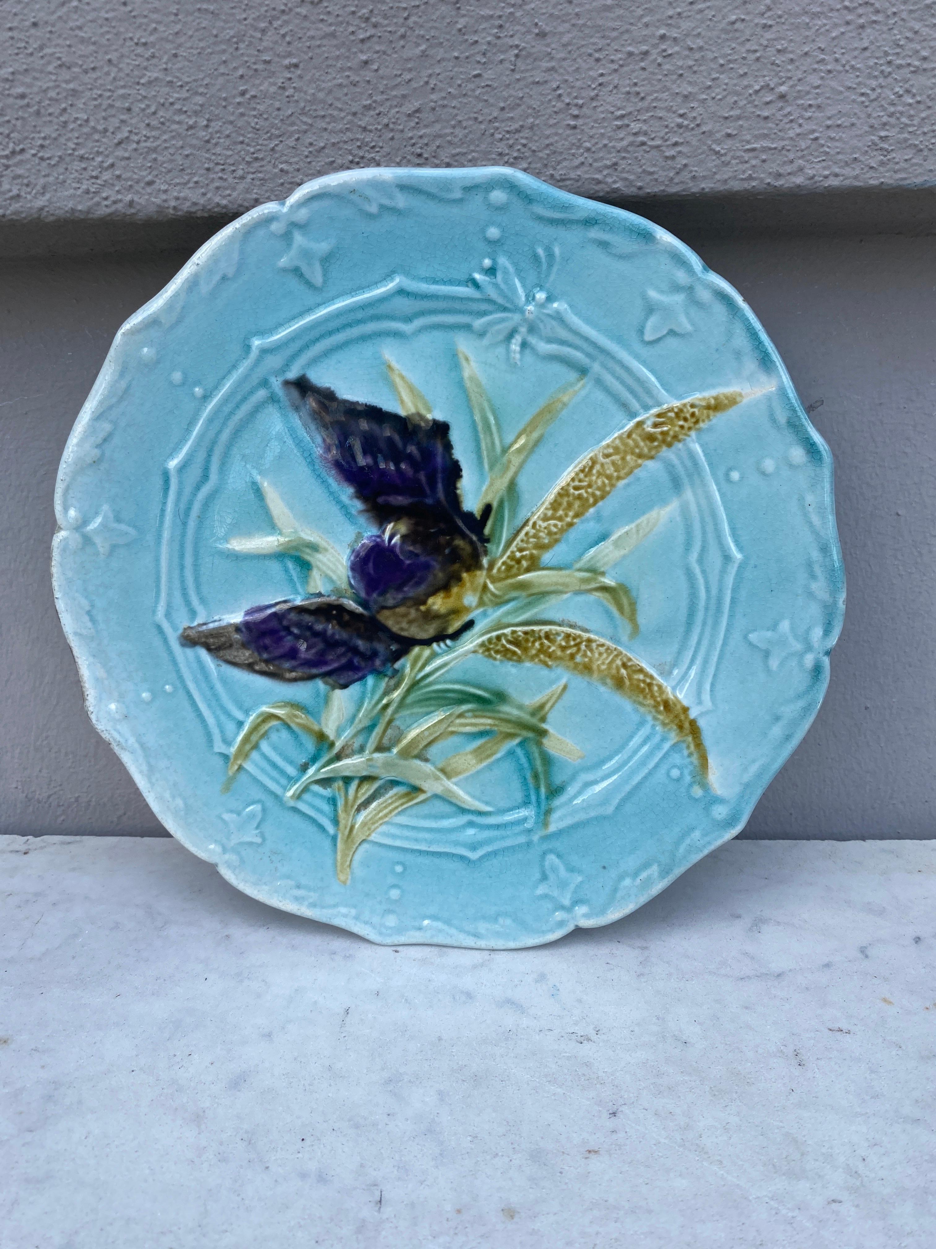 Lovely Majolica plate with bird and insect, leaves signed Saint Amand, circa 1890.