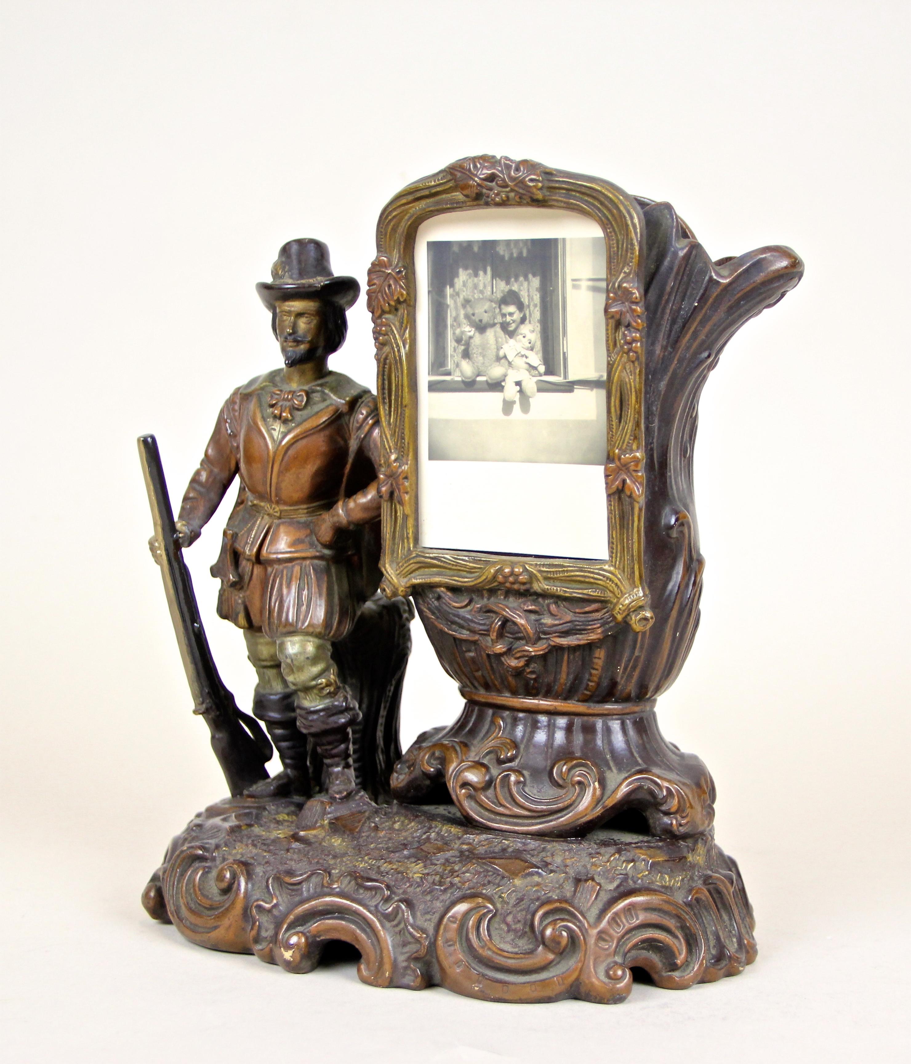 Extraordinary Majolica sculpture vase with photo frame by Johann Maresch, made in Austria, circa 1880. This matchless piece of Majolica depicts a soldier with his gun who leans on the vase´s body. A very unusual item with amazing processed surface