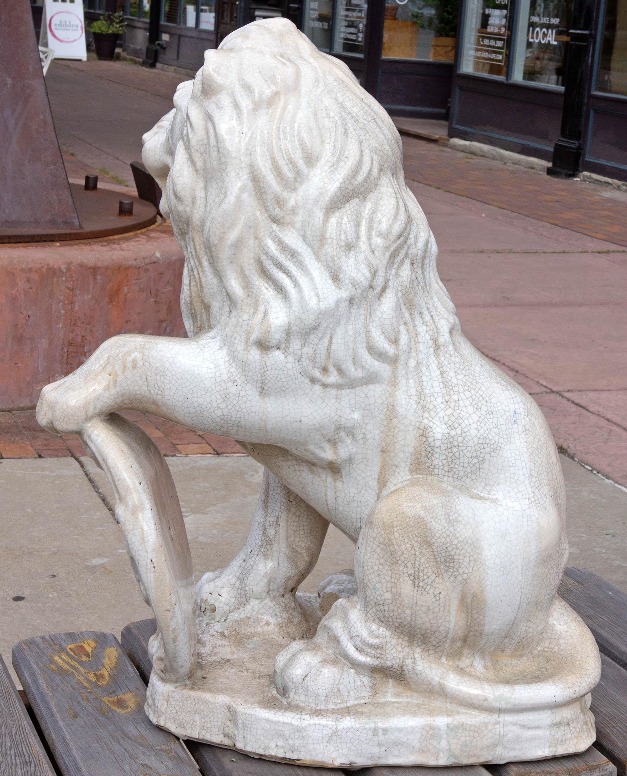 20th Century Majolica Seated Garden Lion Sculpture with Heraldic Shield