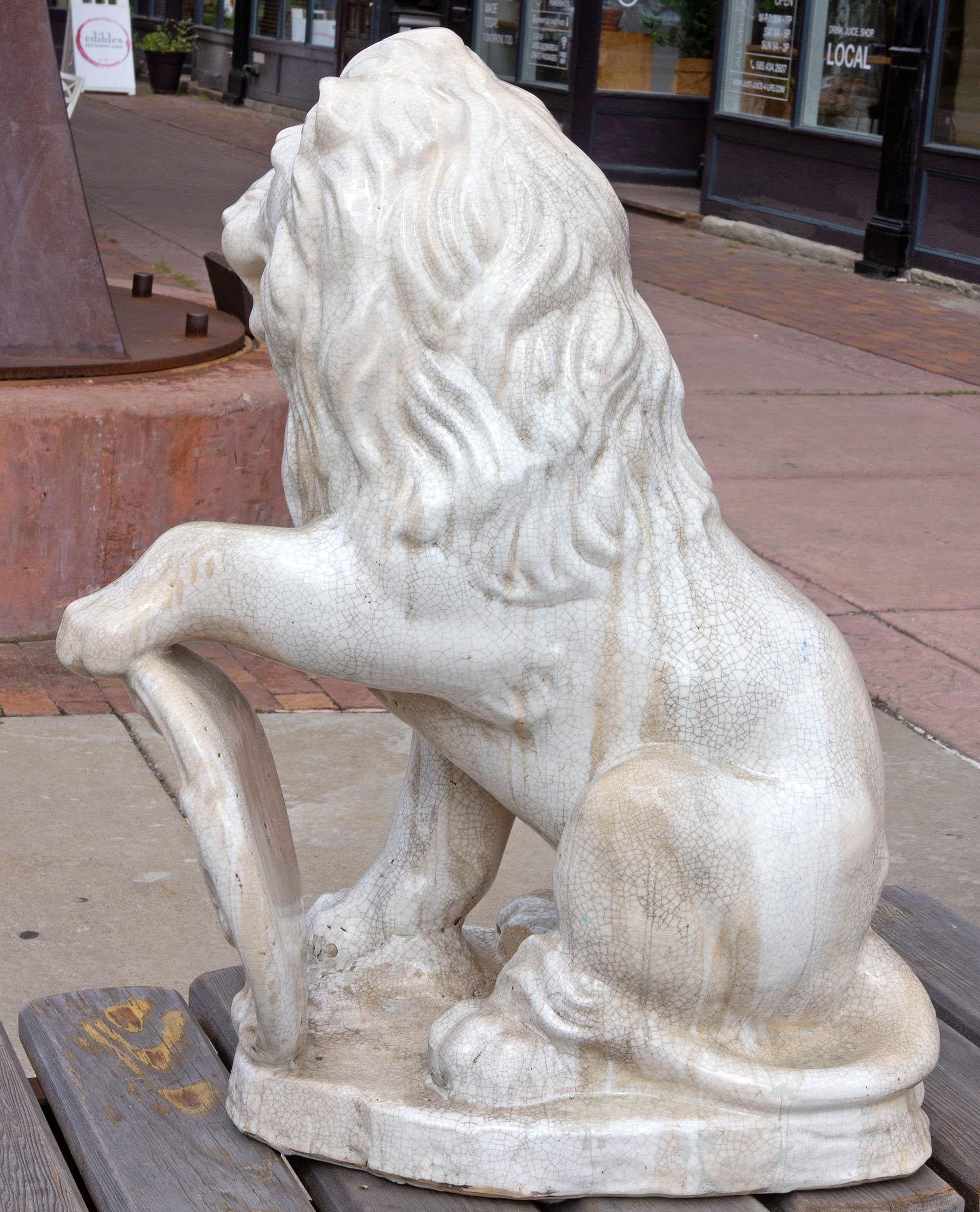 European Majolica Seated Garden Lion Statue with Heraldic Shield For Sale