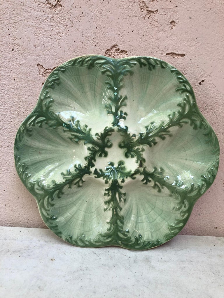Majolica oyster plate attributed to Keller et Guerin Saint Clement, circa 1900.
Usually in pink, rare color.
Reference / Page 98 