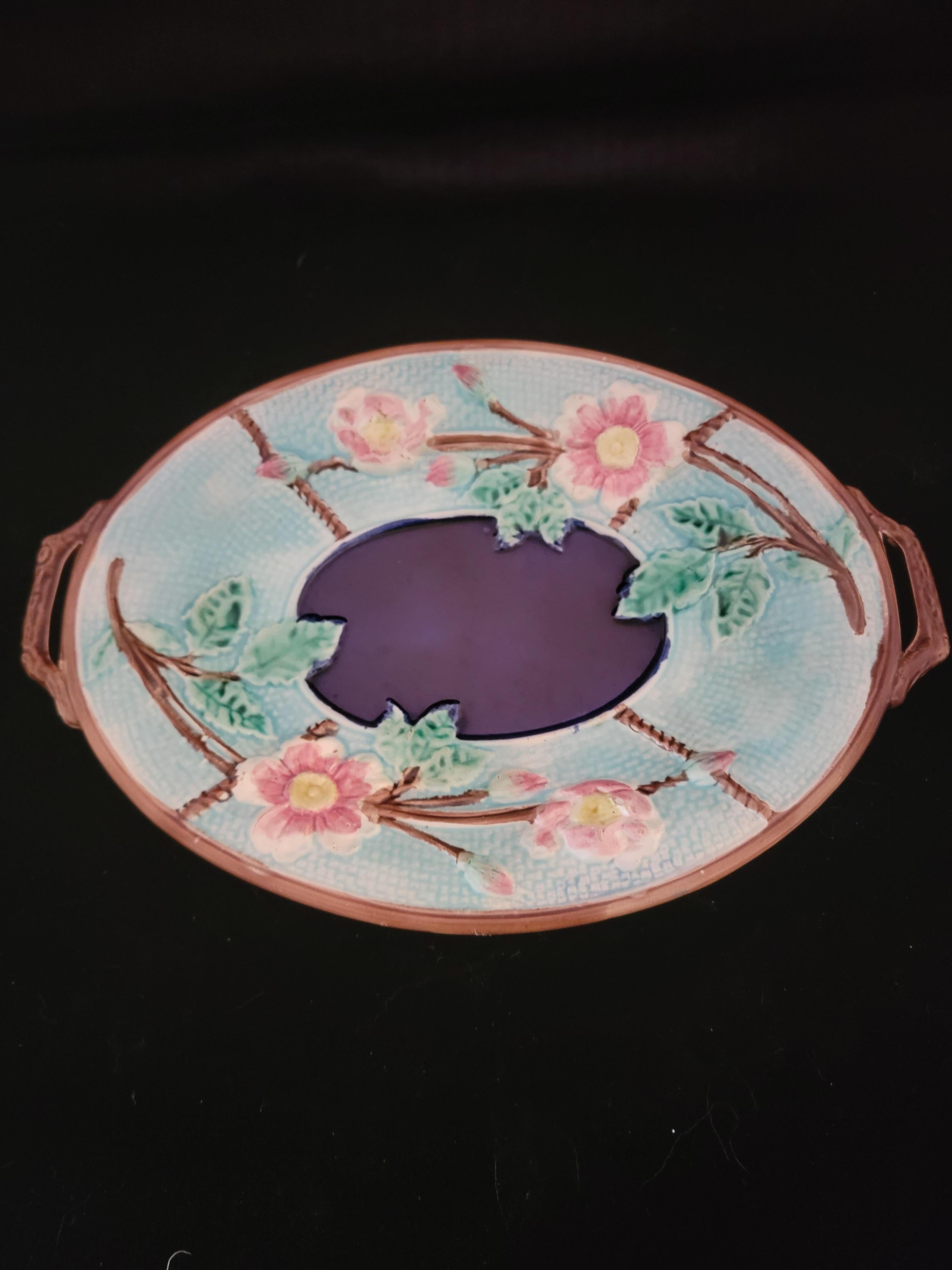This majolica serving dish has several strong attributes. Akthough unattributed as it remains, it has strong color nd remarkable sharpness when viewed from a distant in your collection. It has presence, great form and wonderful color application. It