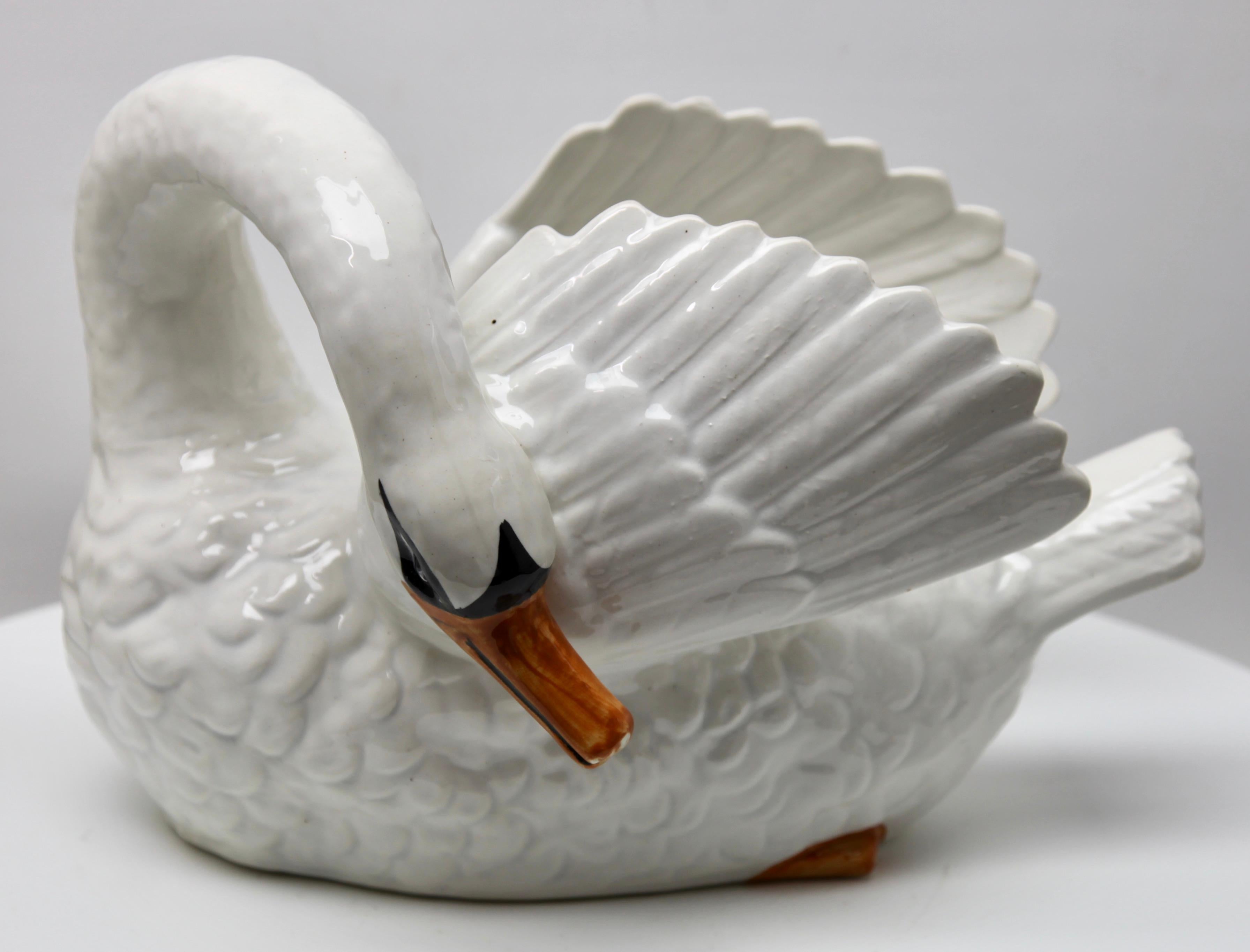 Majolica white swan jardinière Nimy, circa 1900.

Stamped: Nimy Faiences Imperial from 1789-1951 Belgium.
A real treasure for the ceramics' collector.

With best wishes,