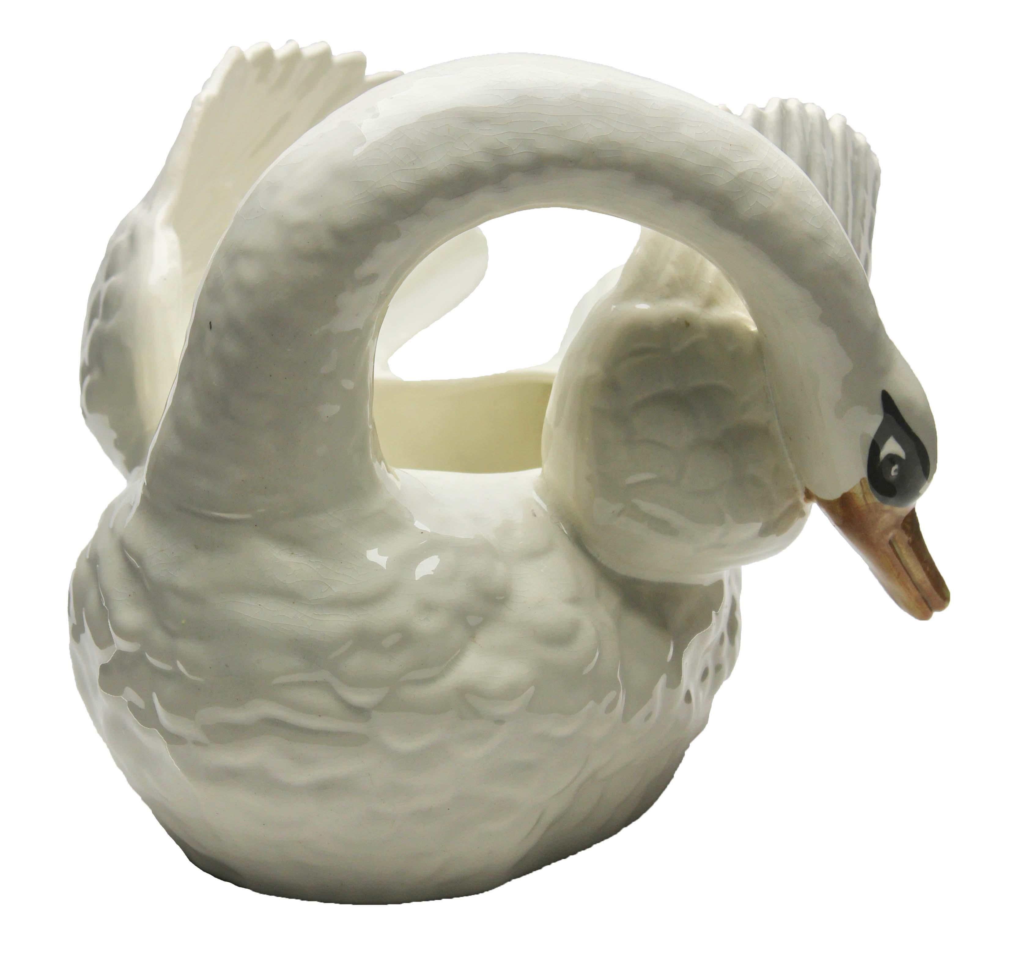 Majolica white swan jardinière Nimy, circa 1900.

Stamped: Nimy Faiences imperiale 1789-1951 Belgium.
A real treasure for the ceramics' collector. 


















 